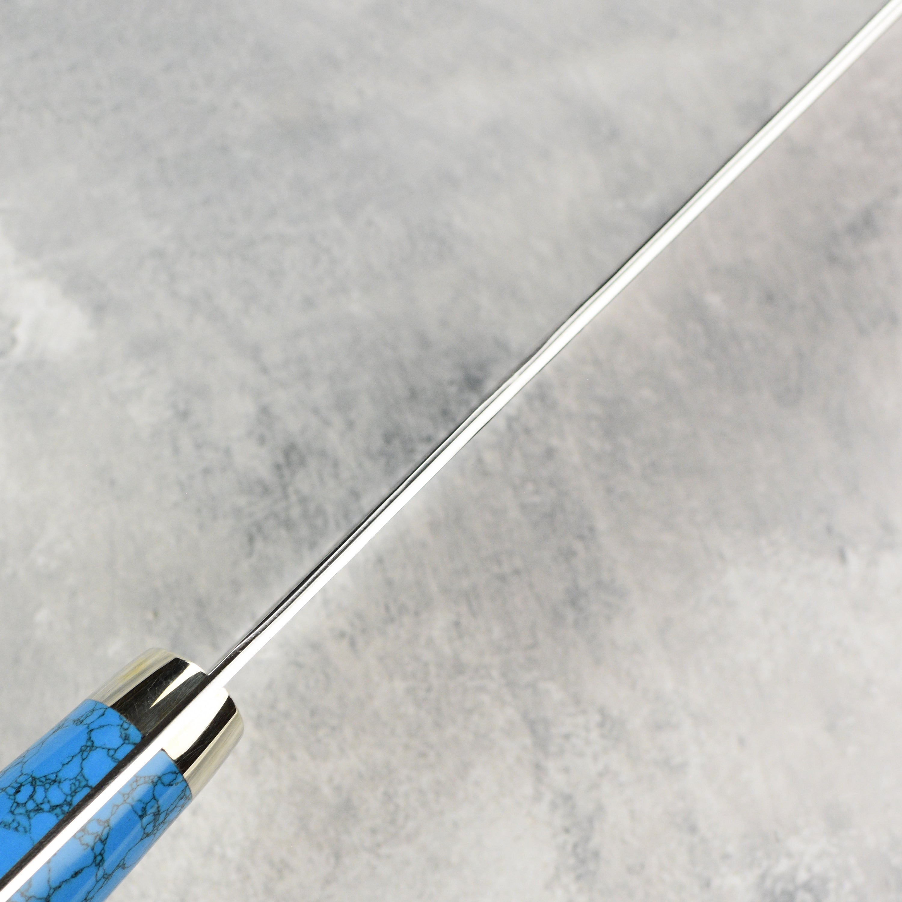 Elegant blue turquoise handle of the Nigara sujihiki chef knife