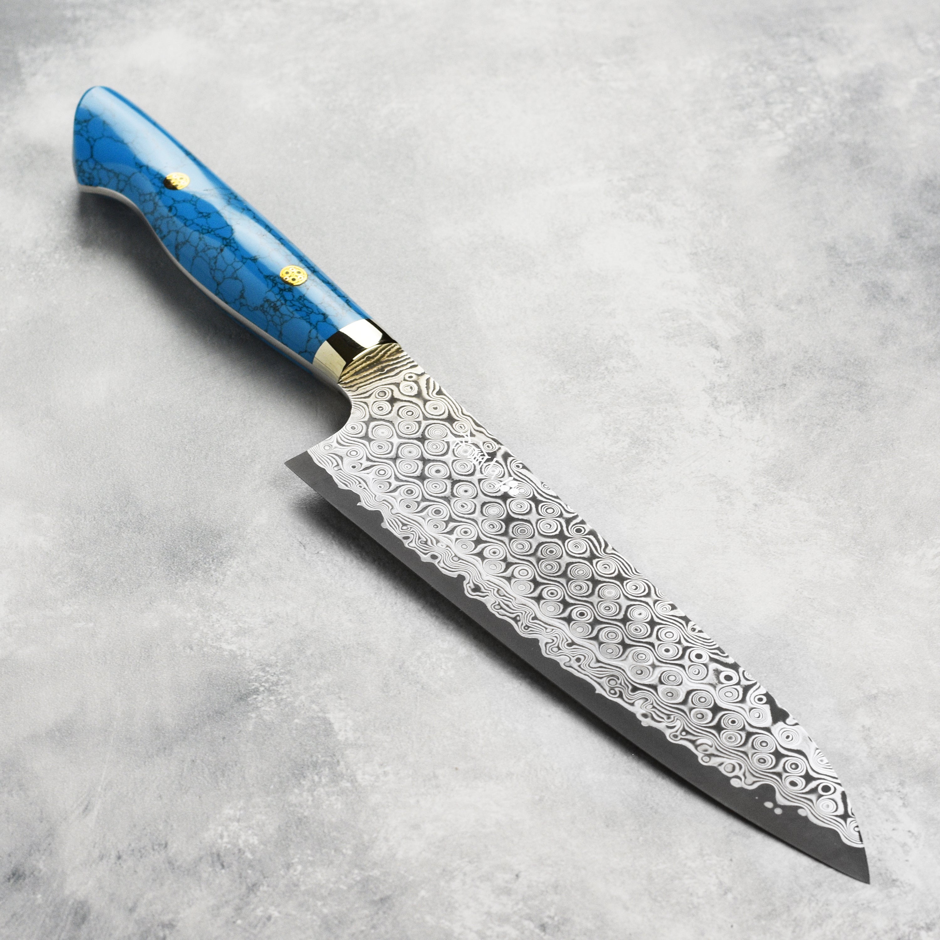 Close-up of the Nigara Damascus knife blade showing intricate steel pattern