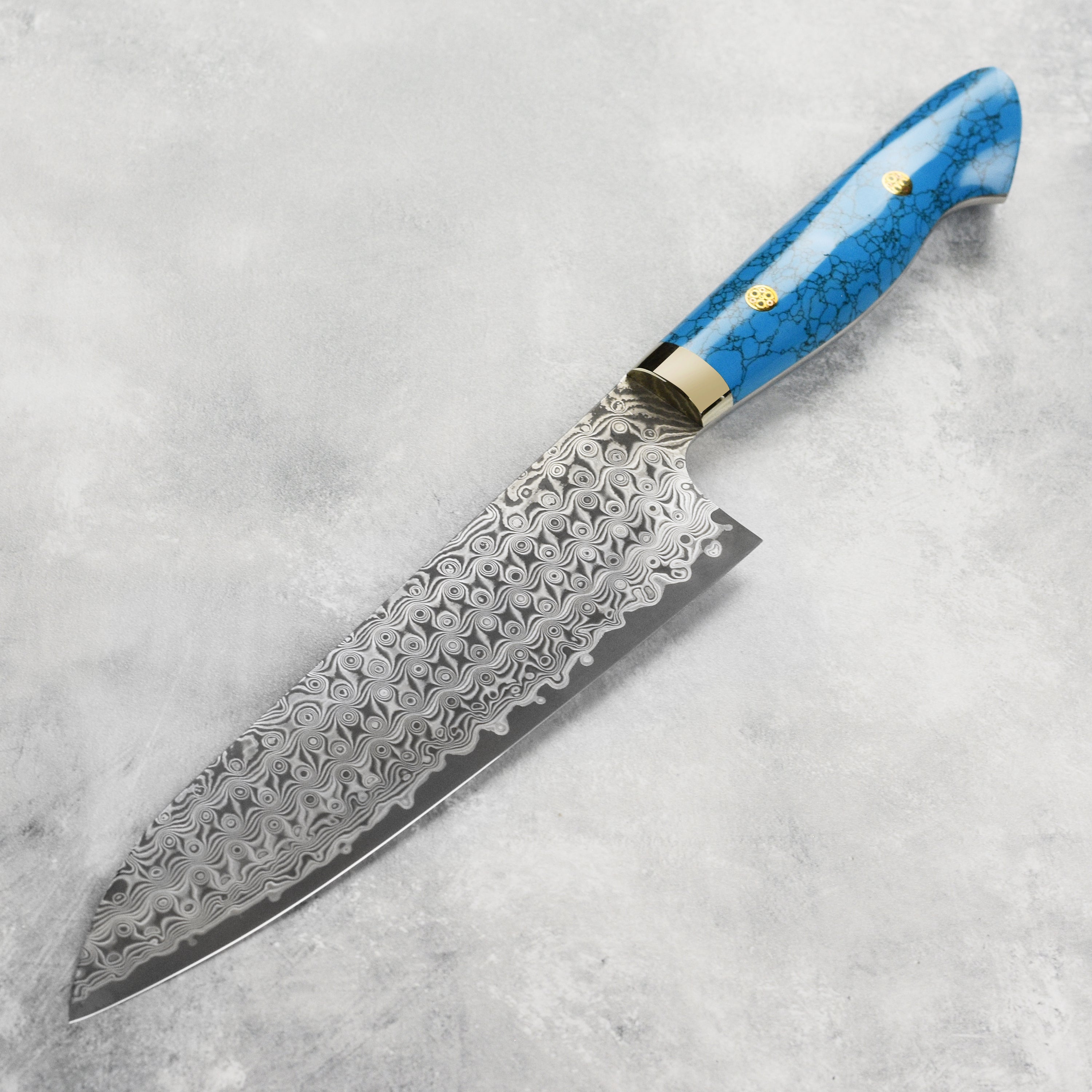Close-up of the Nigara Damascus knife blade showing intricate steel pattern