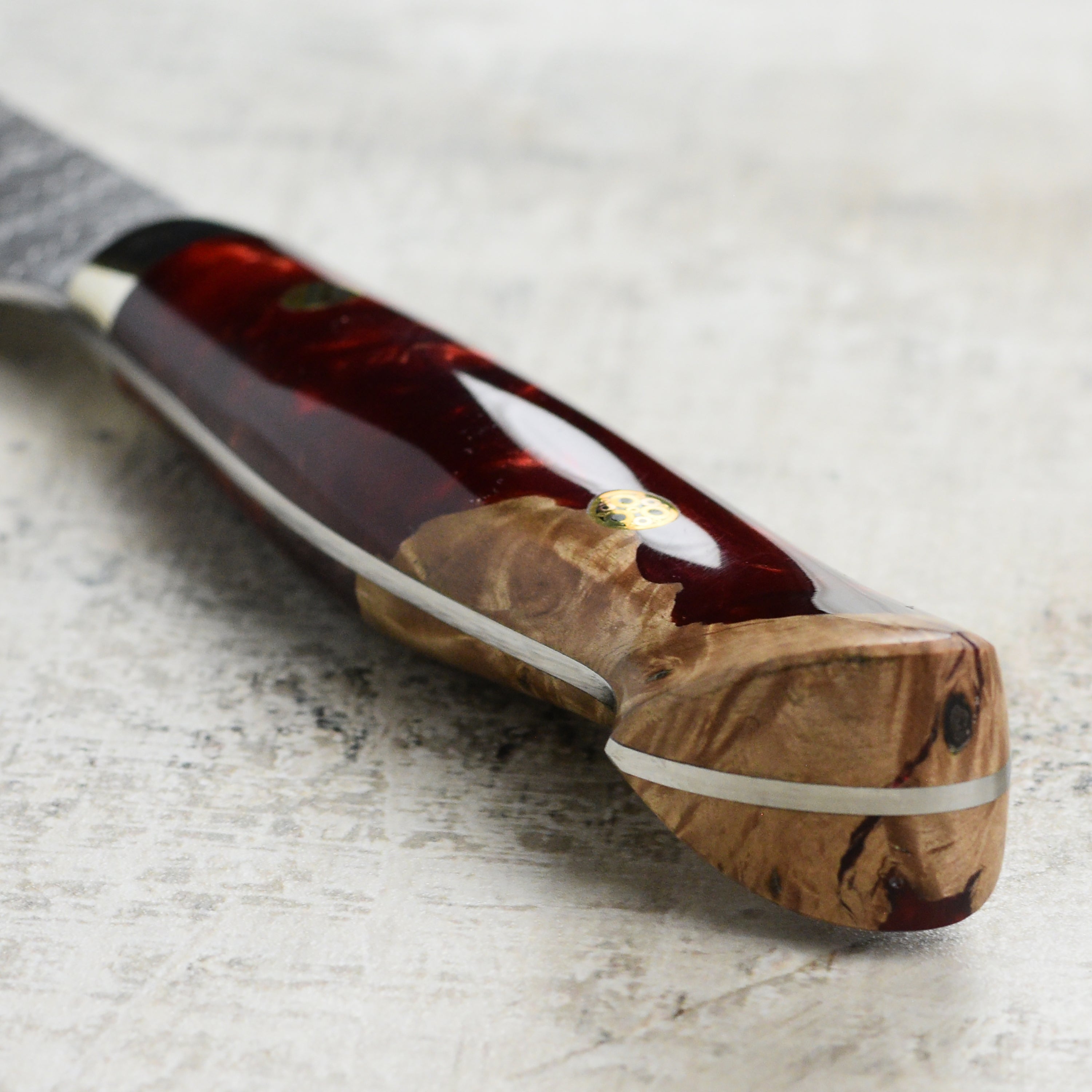 Close-up of the blades sharp edge, showcasing the premium SG2 steel on this top-rated gyuto knife.