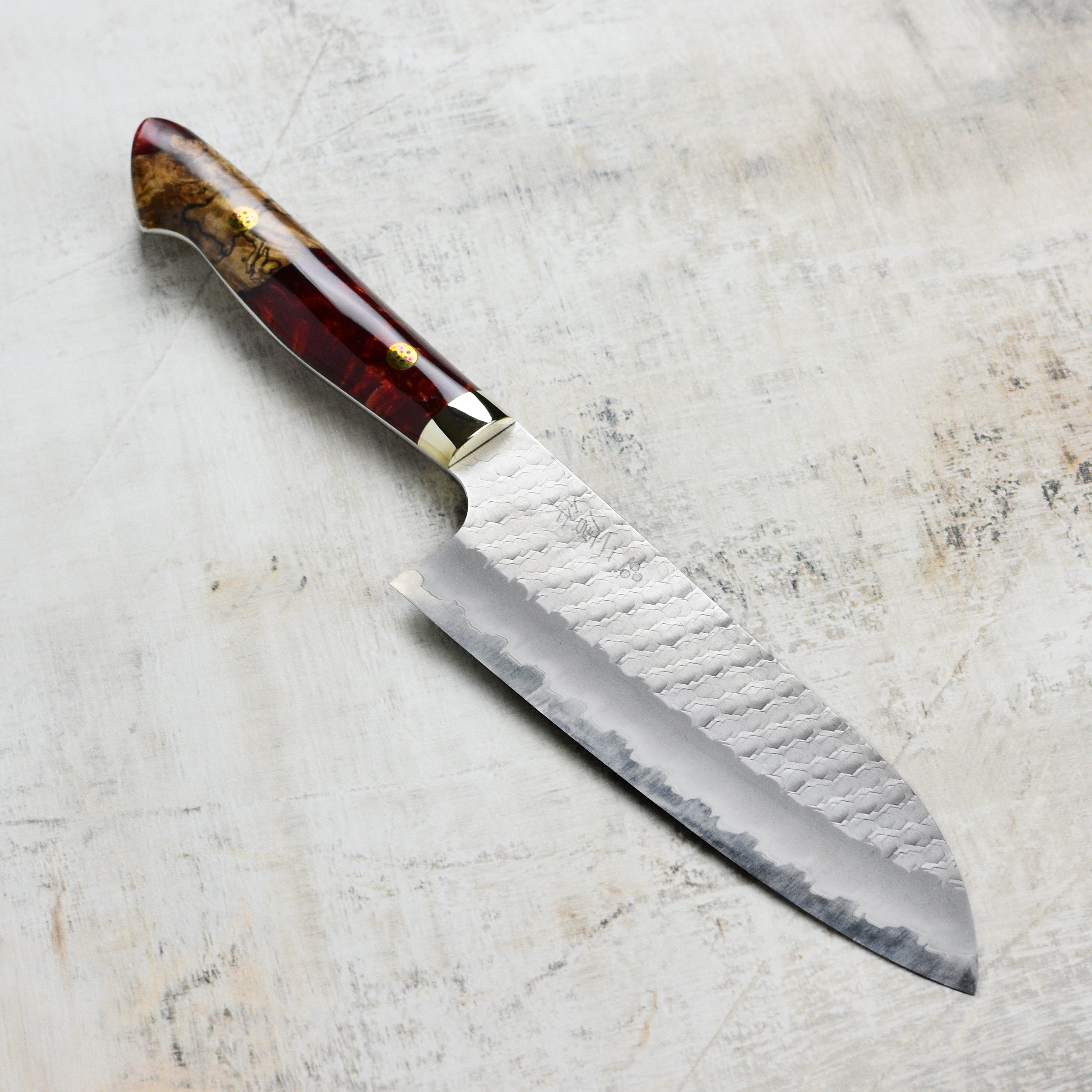 Nigara SG2 Migaki Tsuchime 7-inch Santoku knife with crimson handle, top view