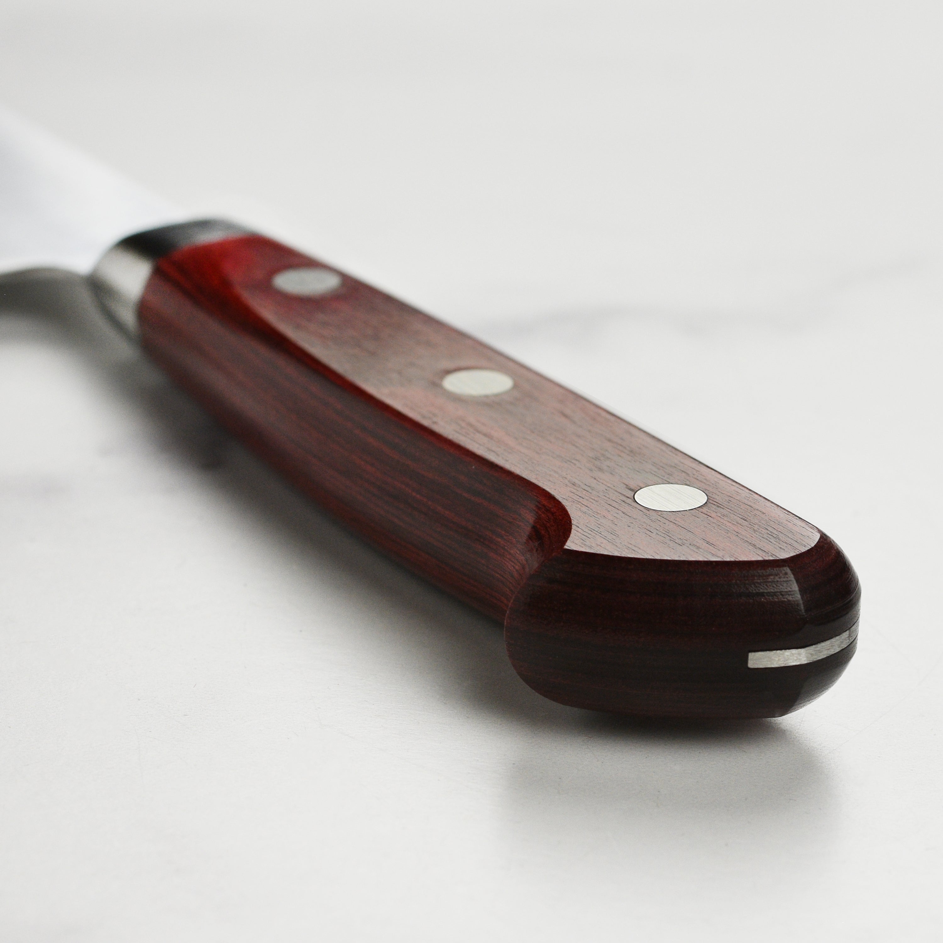 Chef using the Takamura SG2 Gyuto knife for precise vegetable slicing