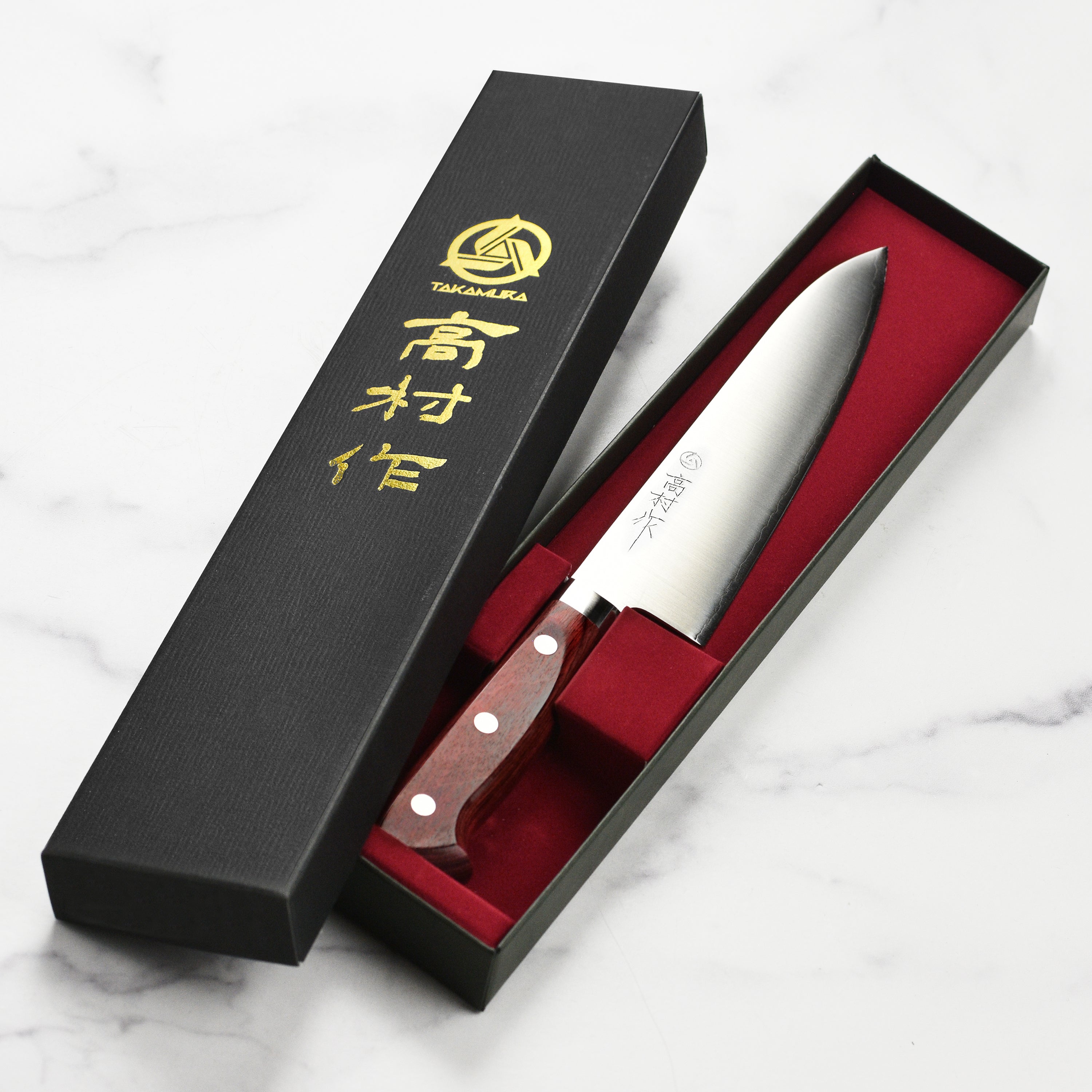 Close-up of the Takamura SG2 Gyuto knife highlighting its elegant handle and craftsmanship
