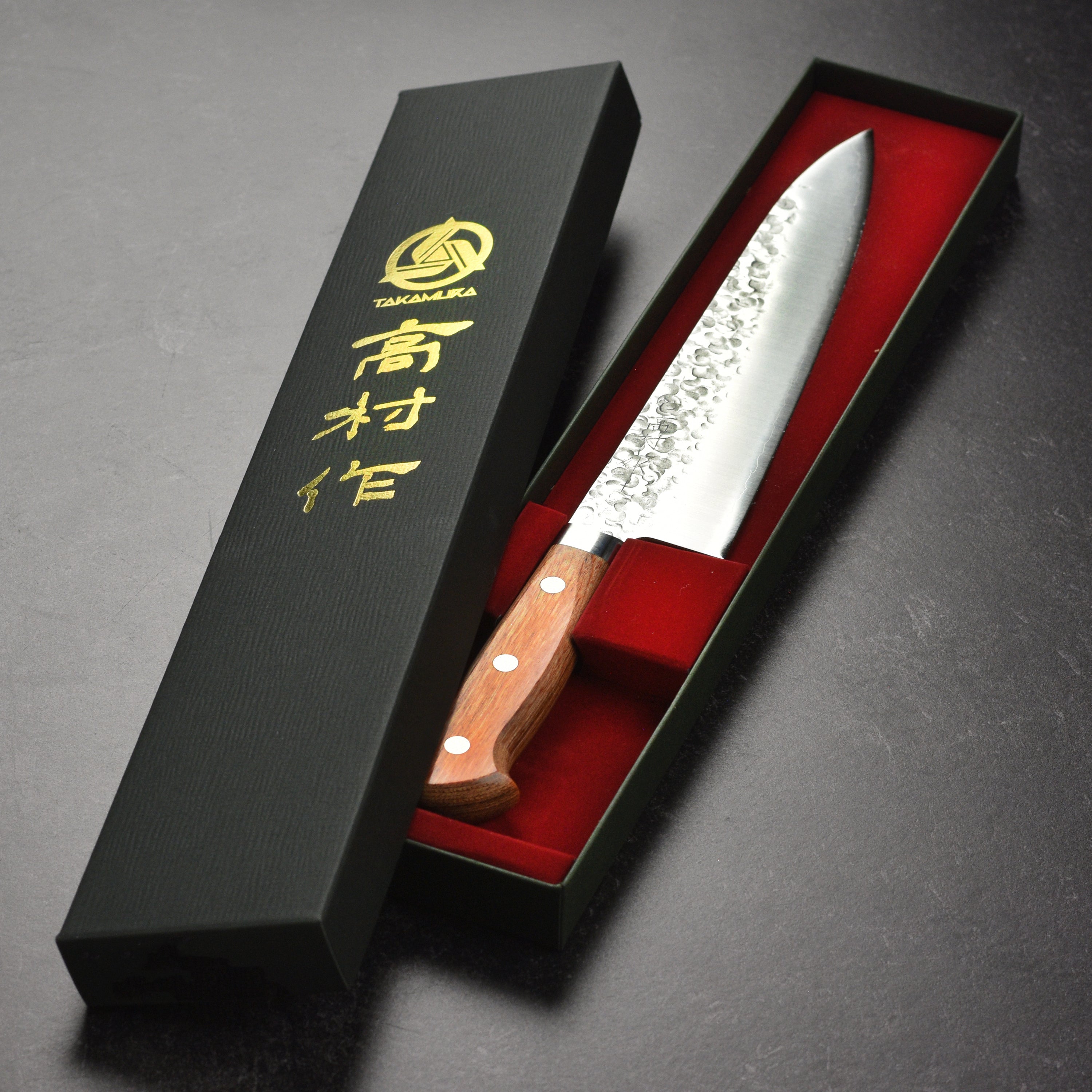 Takamura Chromax Tsuchime Gyuto Knife in use, slicing through vegetables with ease and precision.