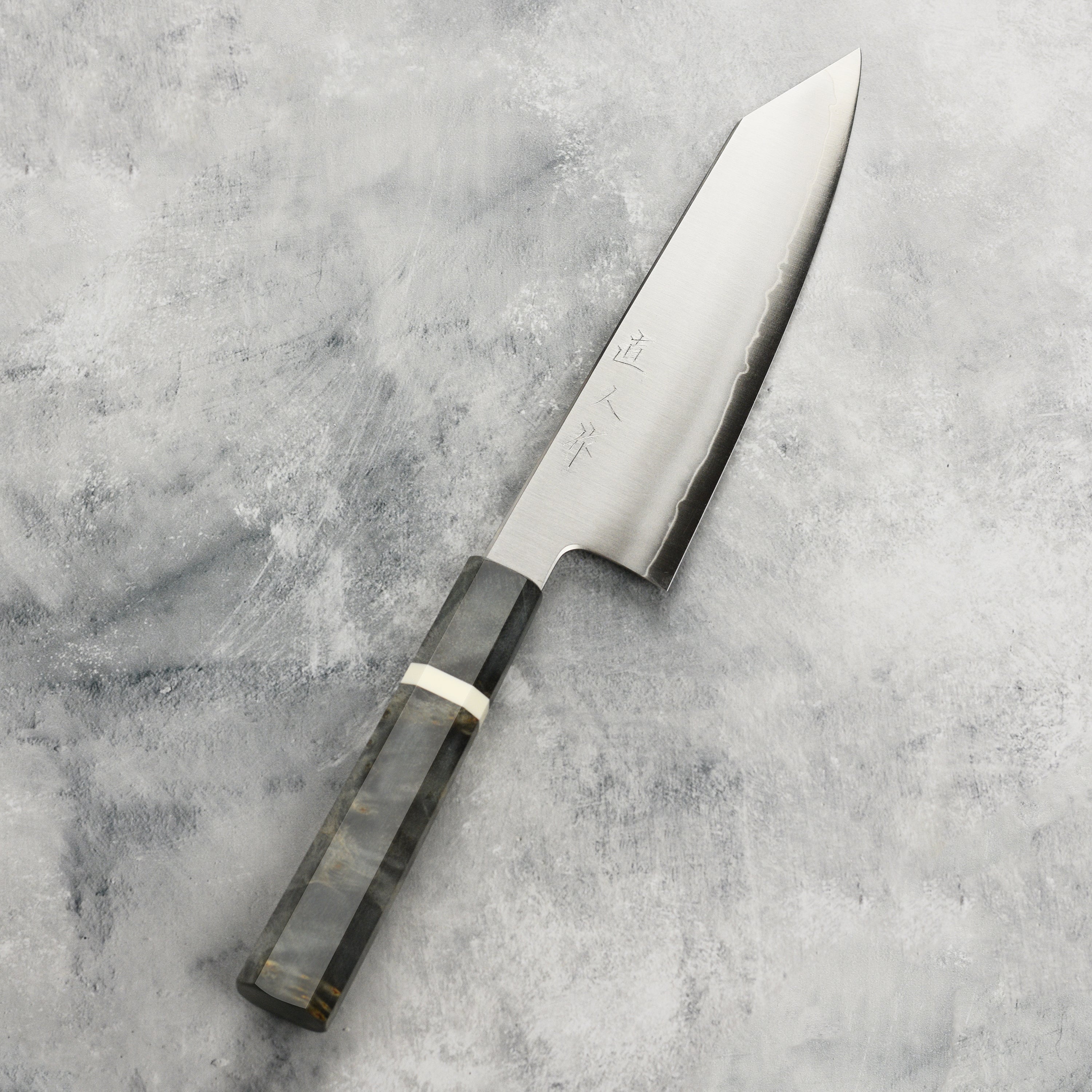 Myojin Riki Bunka Knife being used to slice vegetables, showcasing its precision and effectiveness.
