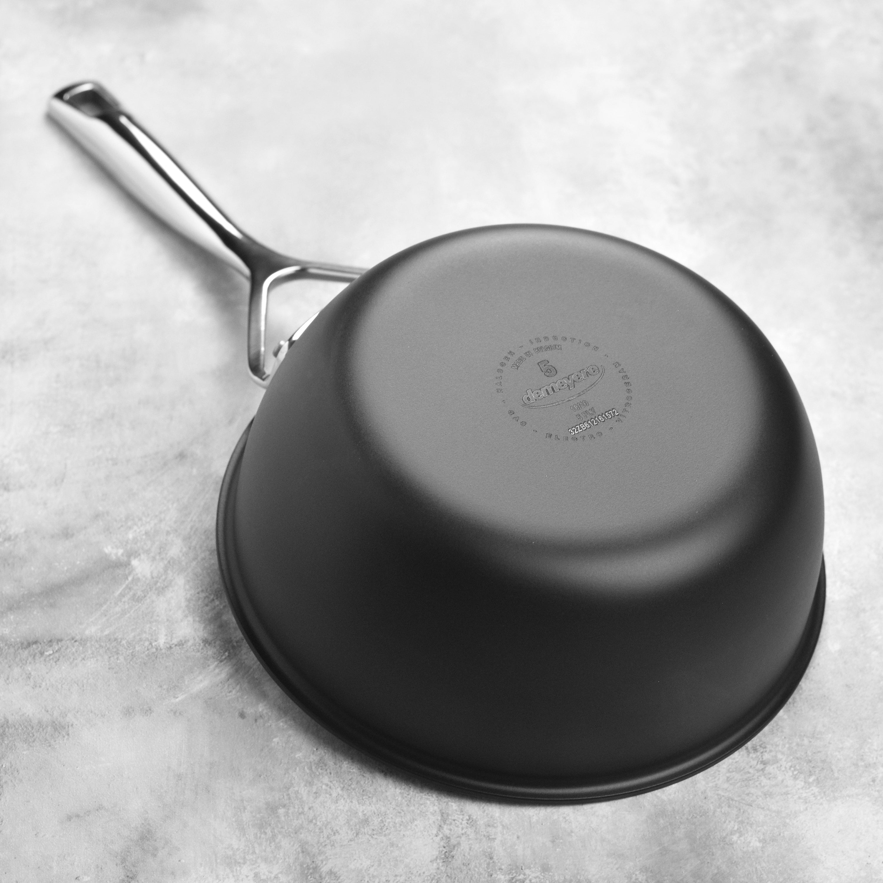 Riveted stay-cool handle of the 2-quart saucepan, highlighting ergonomic design.