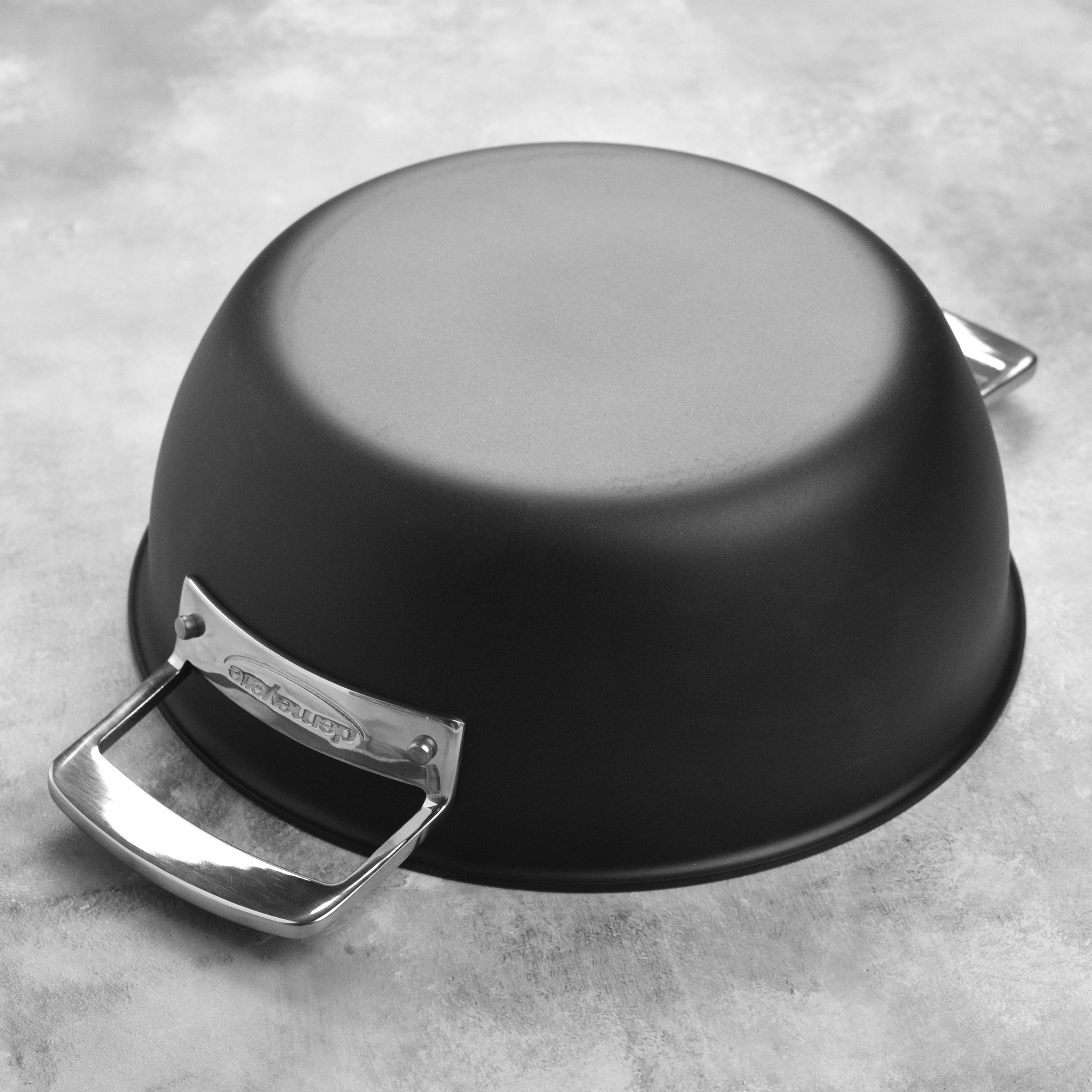 Interior shot showing the even heating surface of the cast iron pot, ideal for baking and slow cooking.