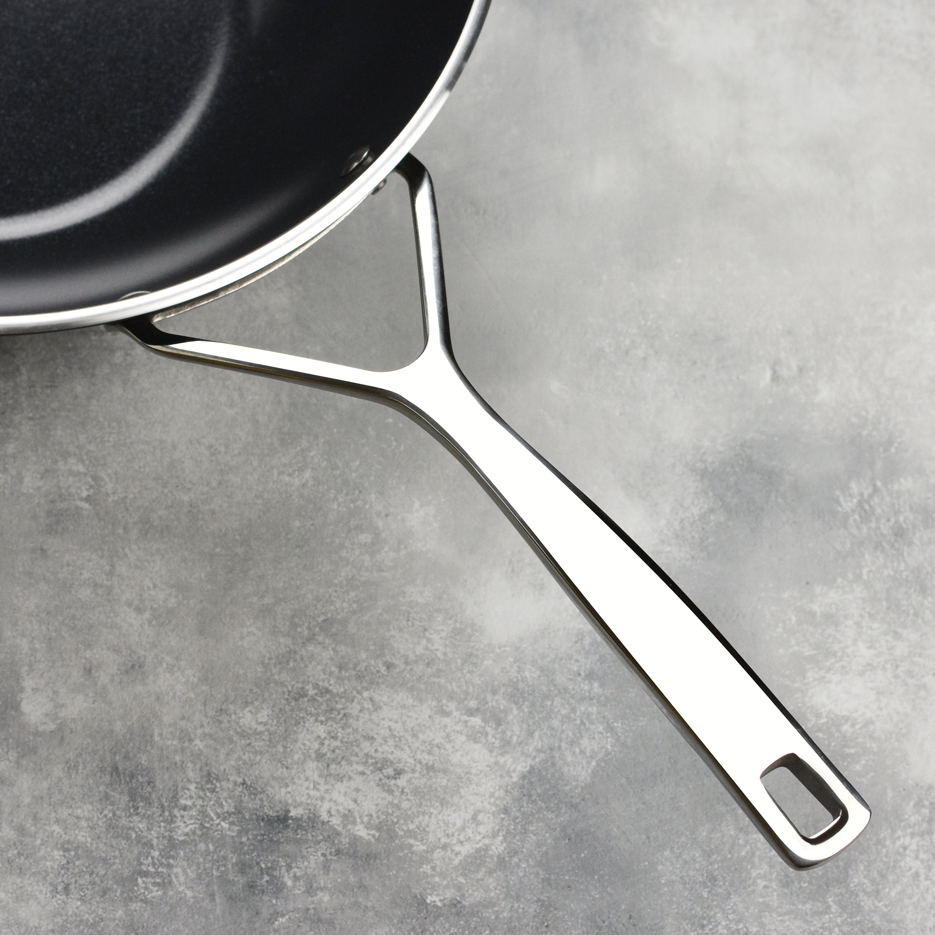 Close-up of nonstick ceramic coating resisting scratches from metal utensil use