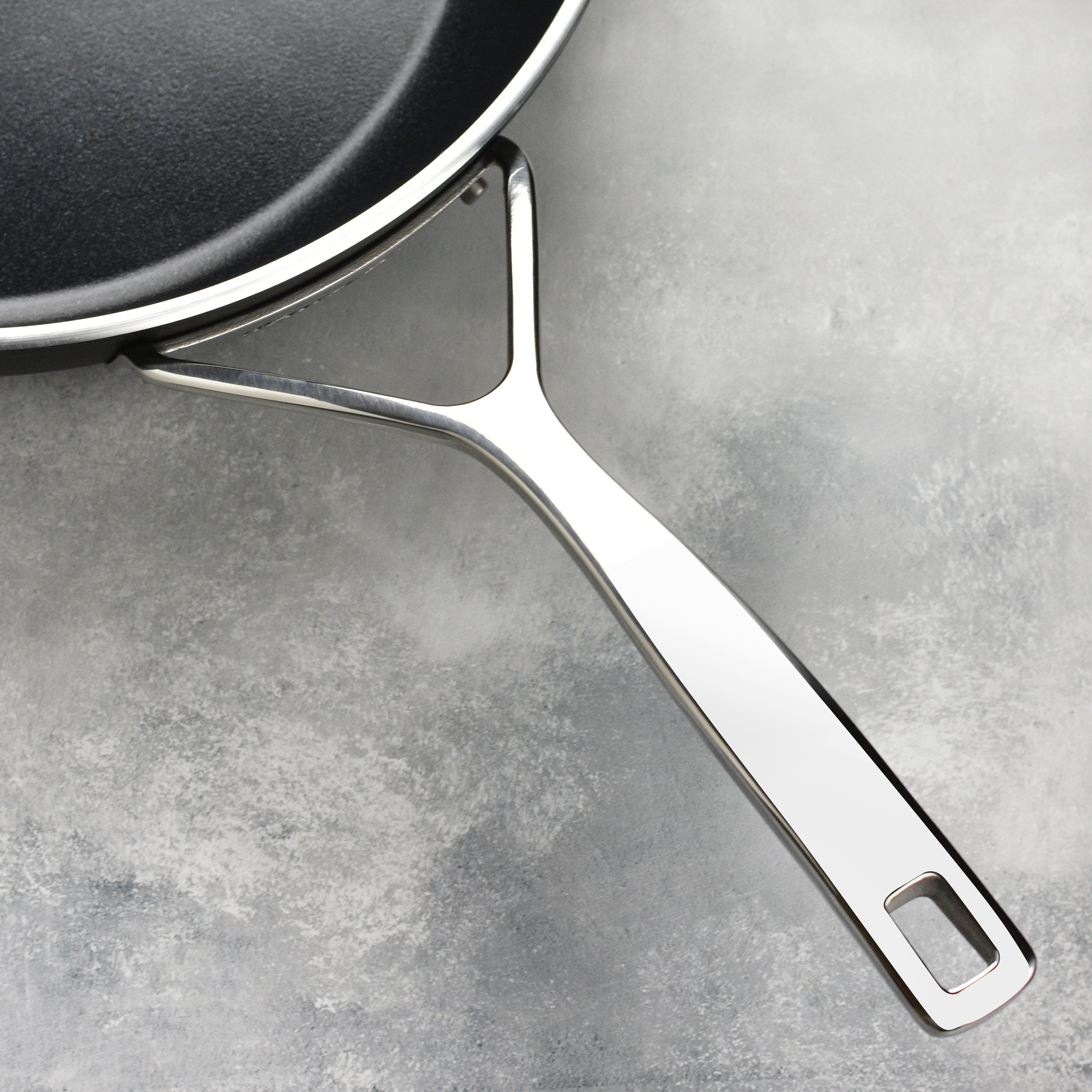 Demeyere AluPro 10" Ceramic Fry Pan being used for sautéing vegetables, illustrating its nonstick capabilities.