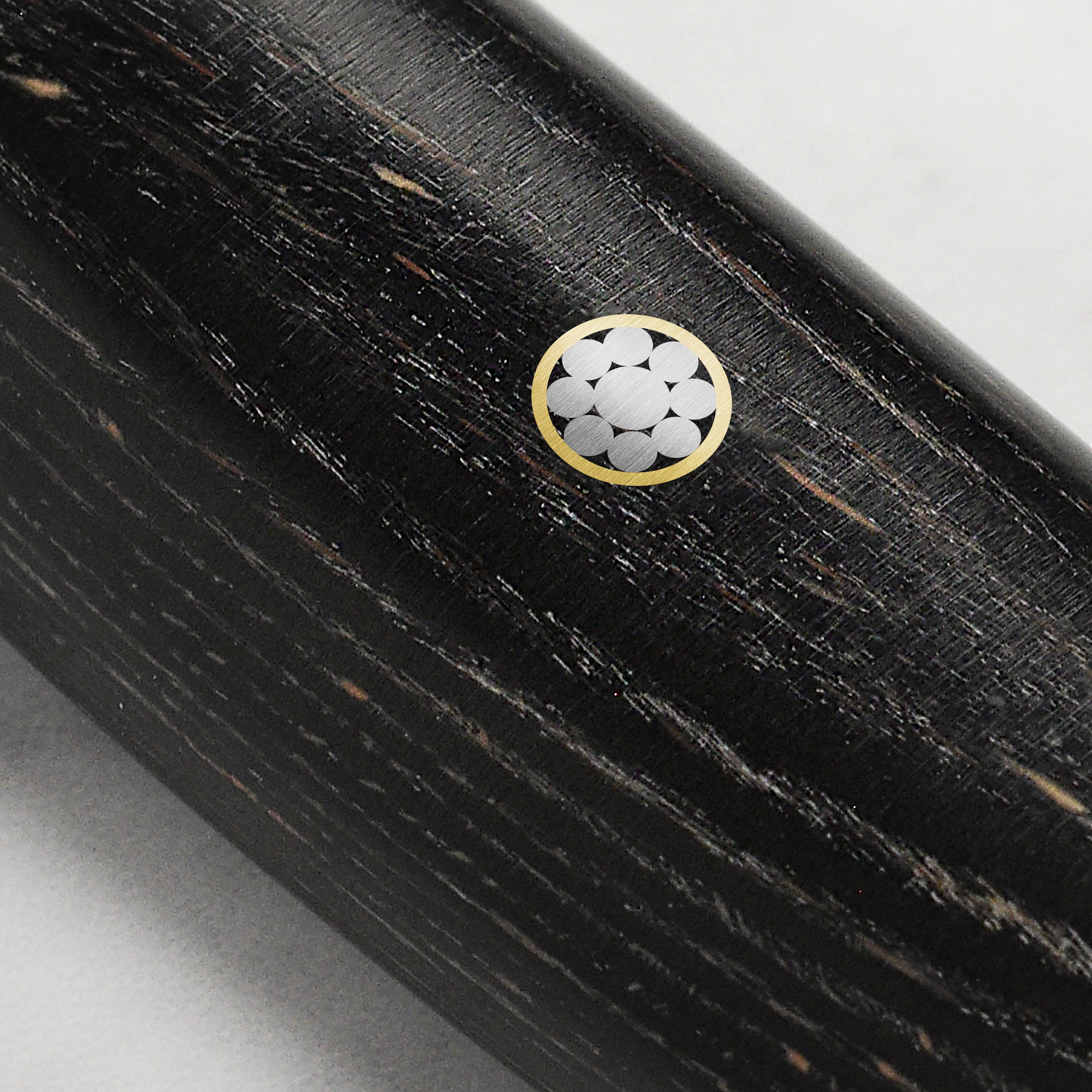 Close-up of the Yaxell Ketu knife blade showcasing the hammered finish and SG2 steel core.