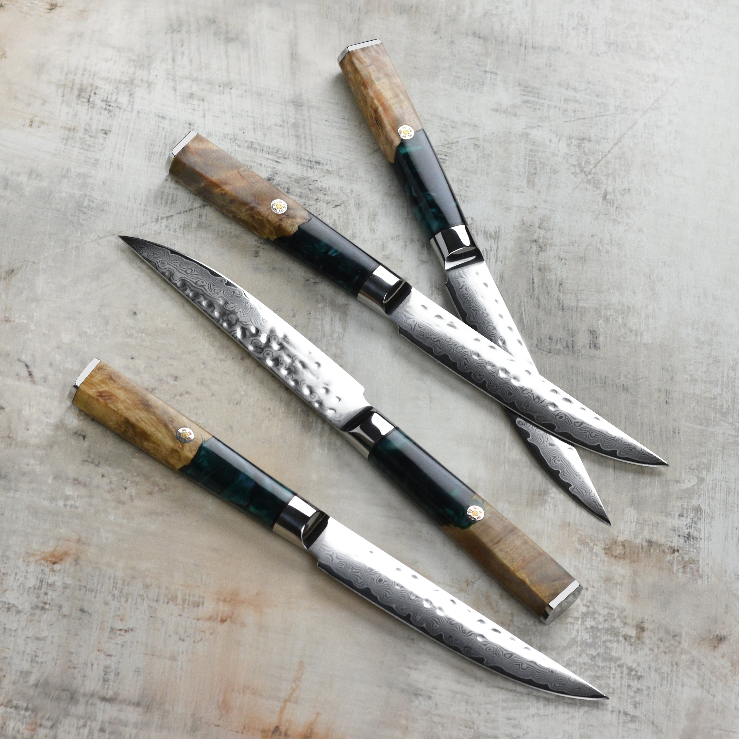 Set of four premium Damascus steak knives in acacia wood storage case