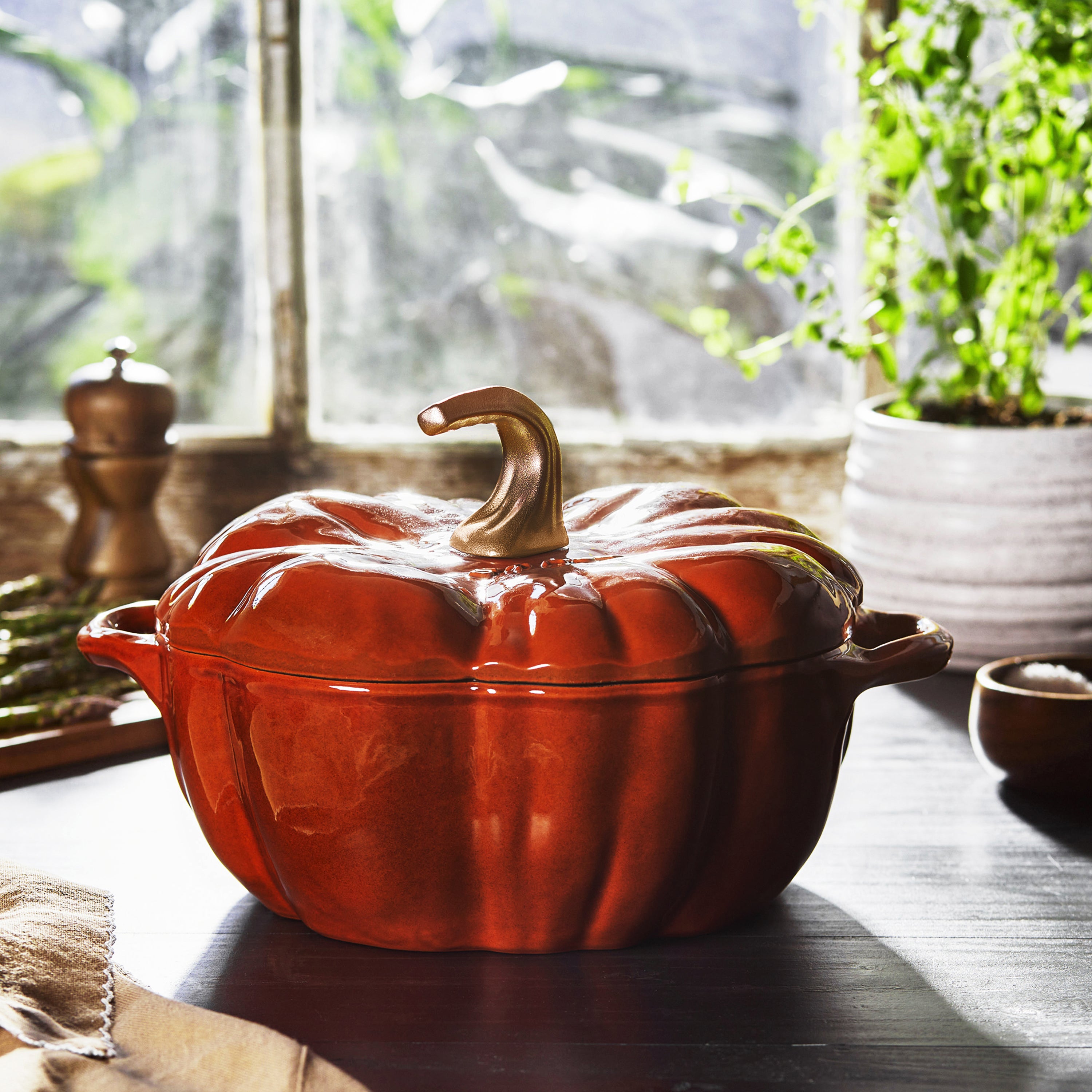 Top view of the burnt orange cast iron cocotte showcasing its unique pumpkin shape.