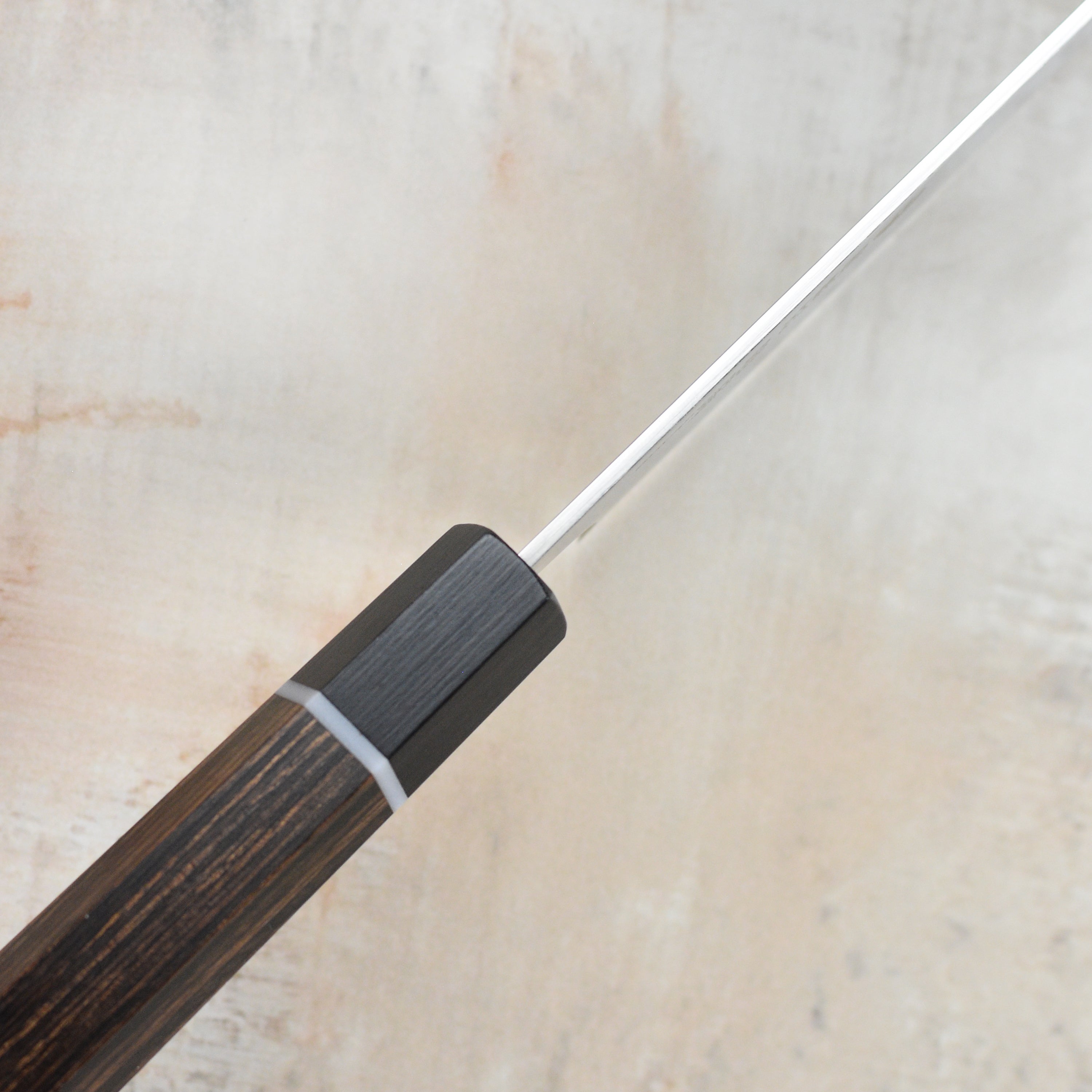 Close-up of the Seki Kanetsugu Zuiun SG2 Sujihiki Chef Knifes ergonomic handle for comfort.