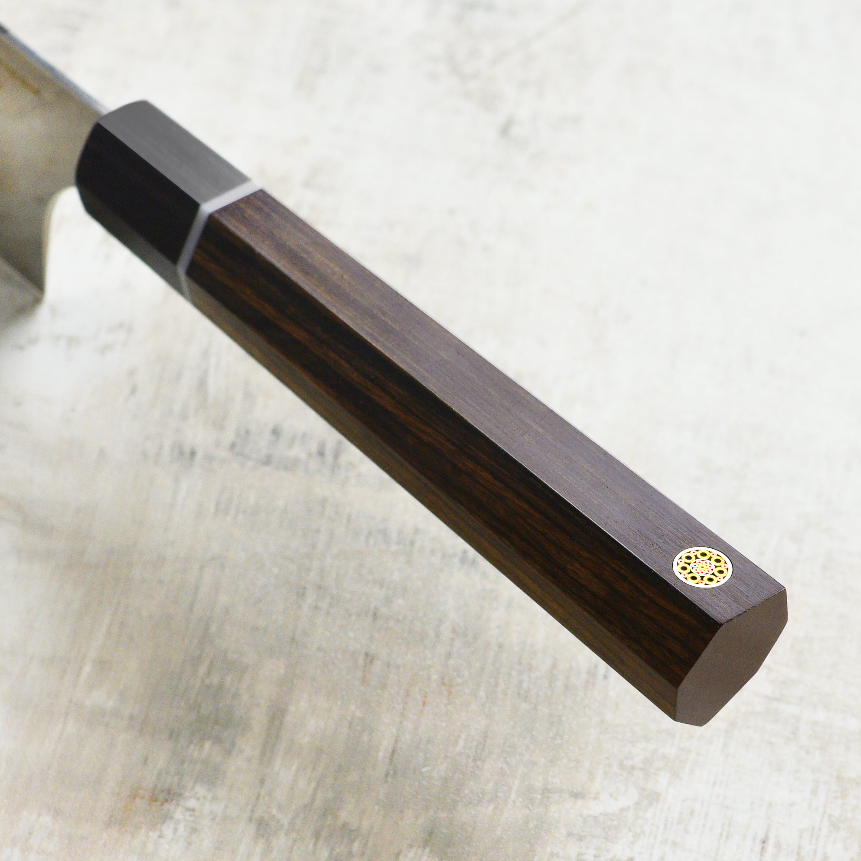 Close-up of the Seki Kanetsugu Zuiun SG2 Sujihiki Chef Knifes ergonomic handle for comfort.