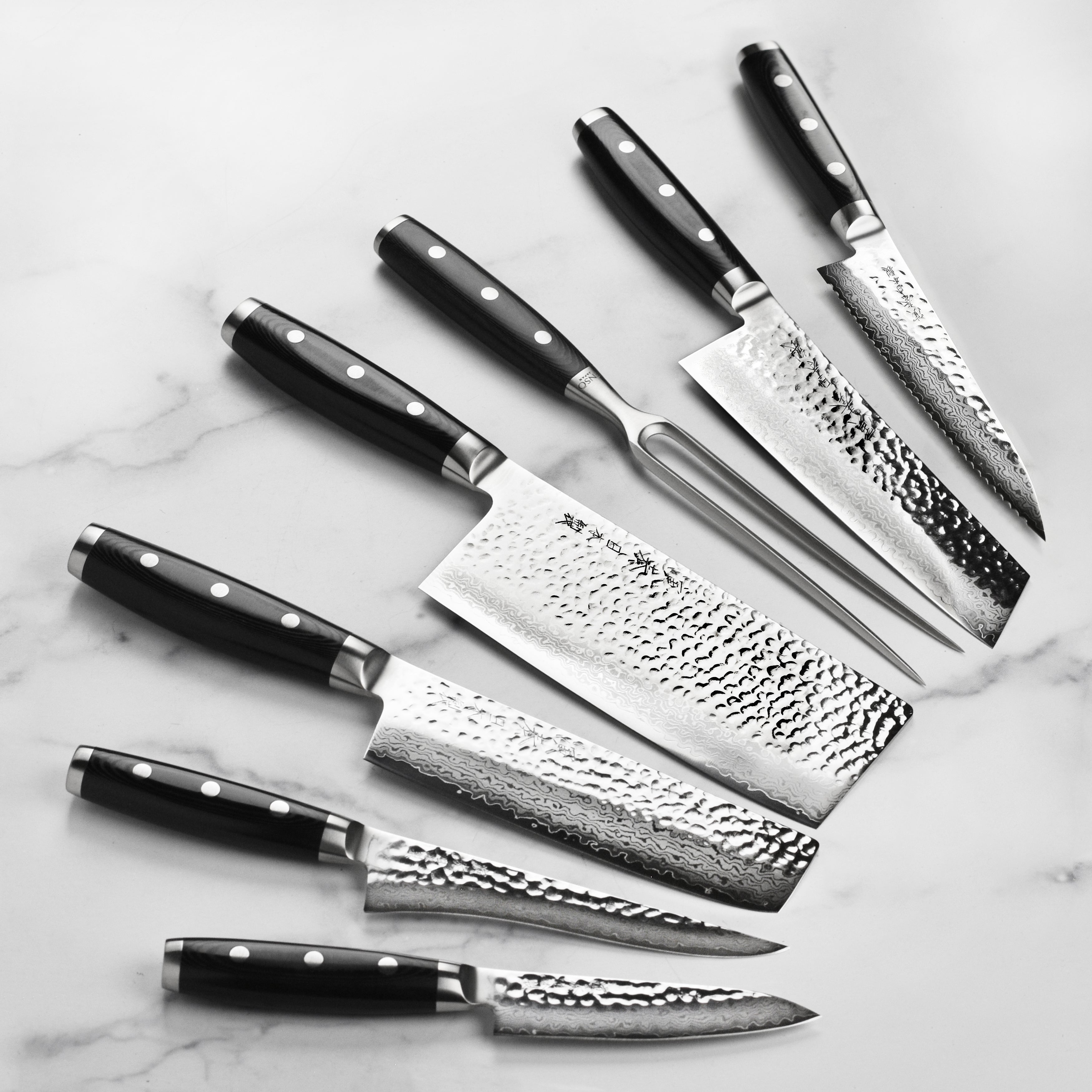 Enso HD Damascus knife set displayed with a wooden cutting board and fresh vegetables