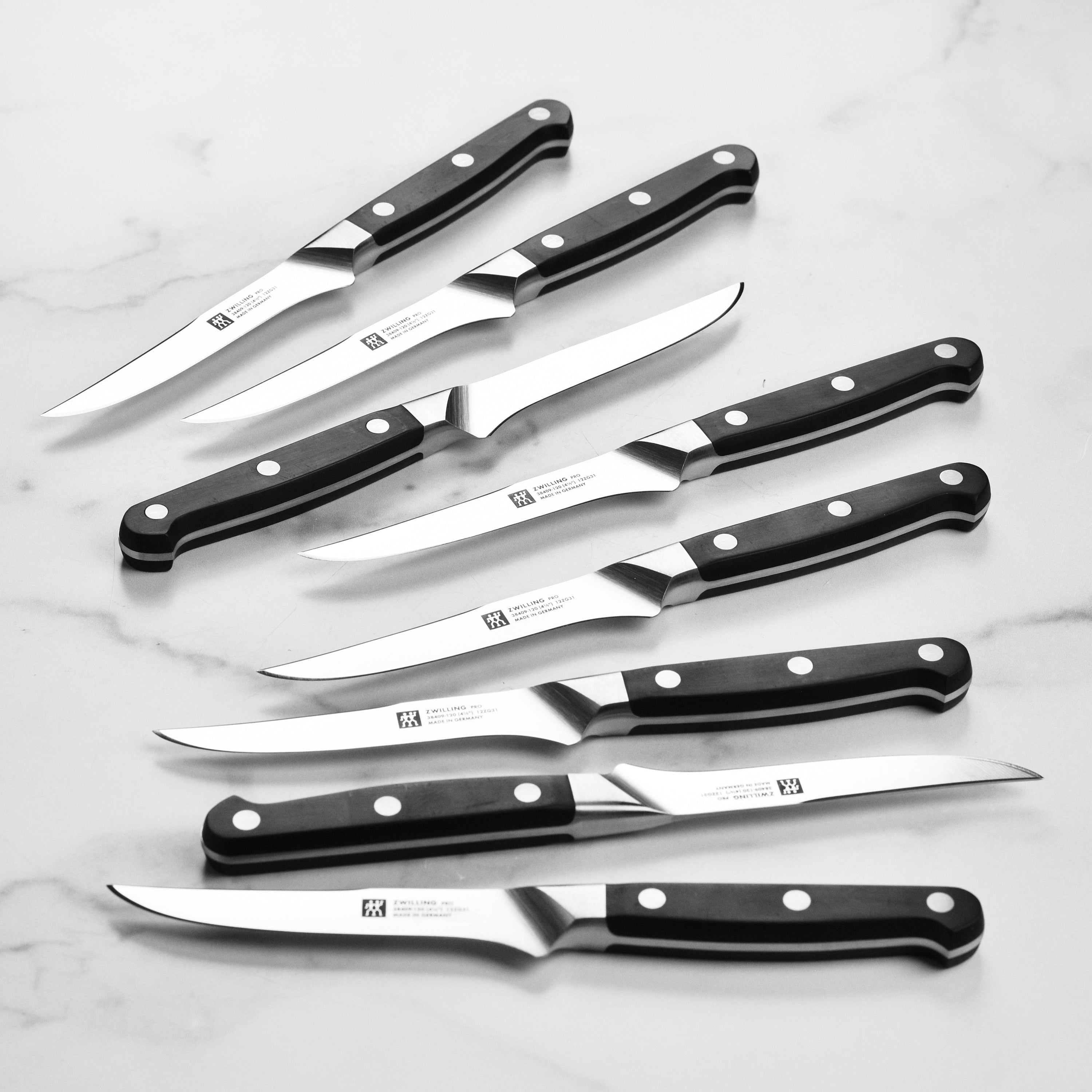 Side view of the Zwilling Pro knife block set showcasing the high carbon steel knives and steak knives.