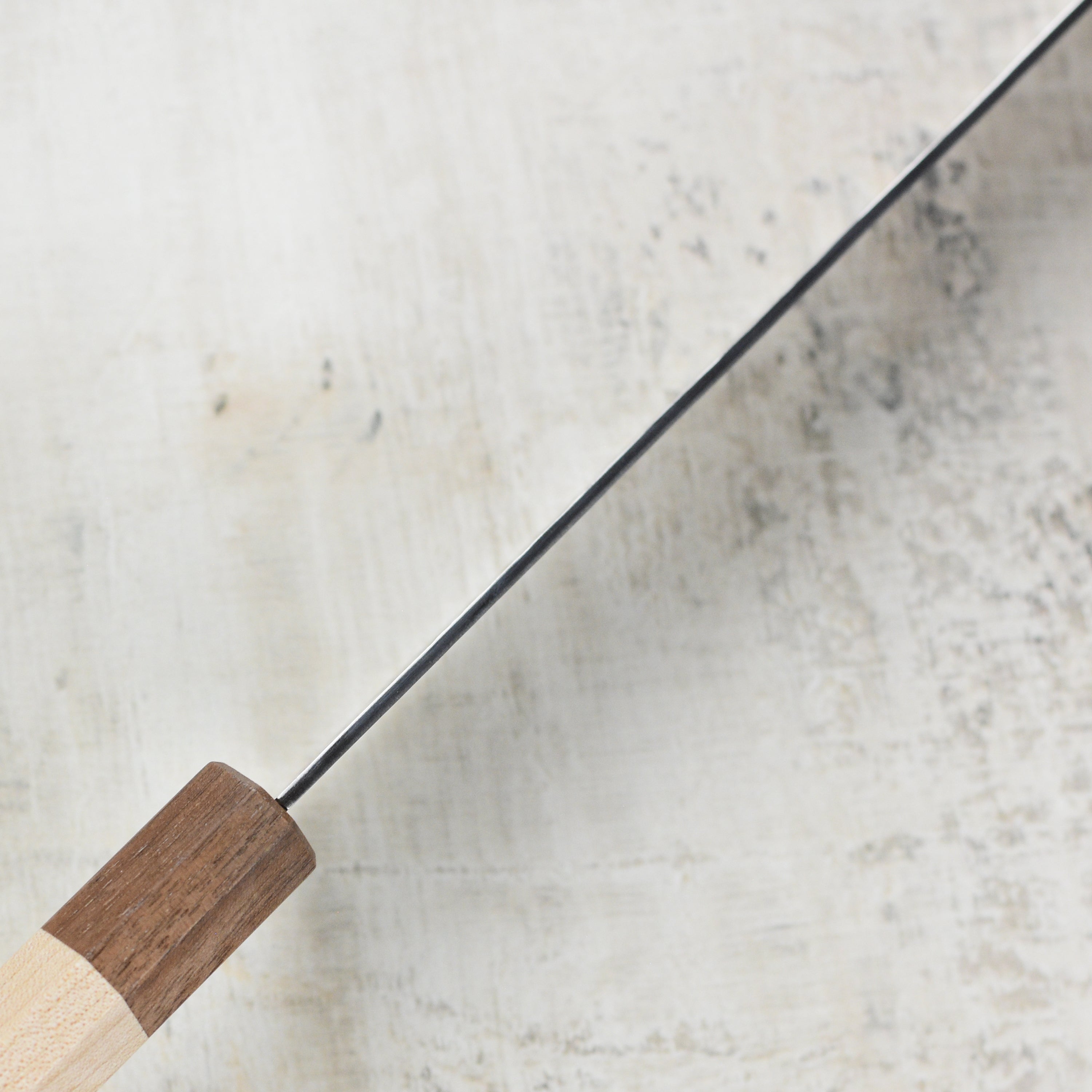 Close-up of the aogami super steel blade of the Kurosaki chef knife.
