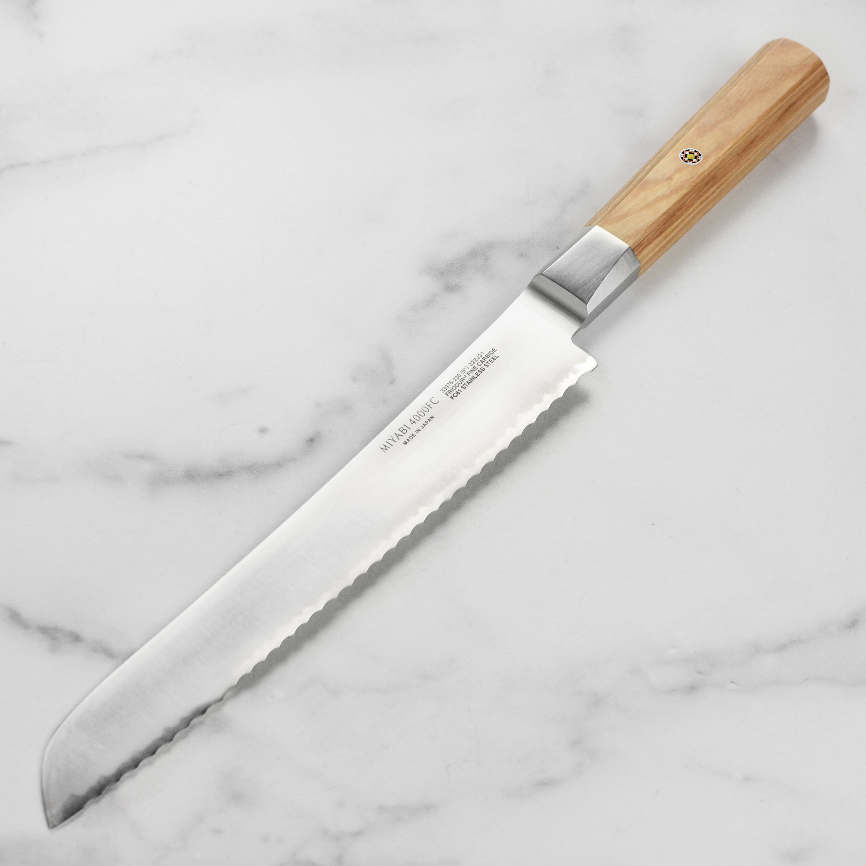Professional bread knife in use, slicing bread effortlessly
