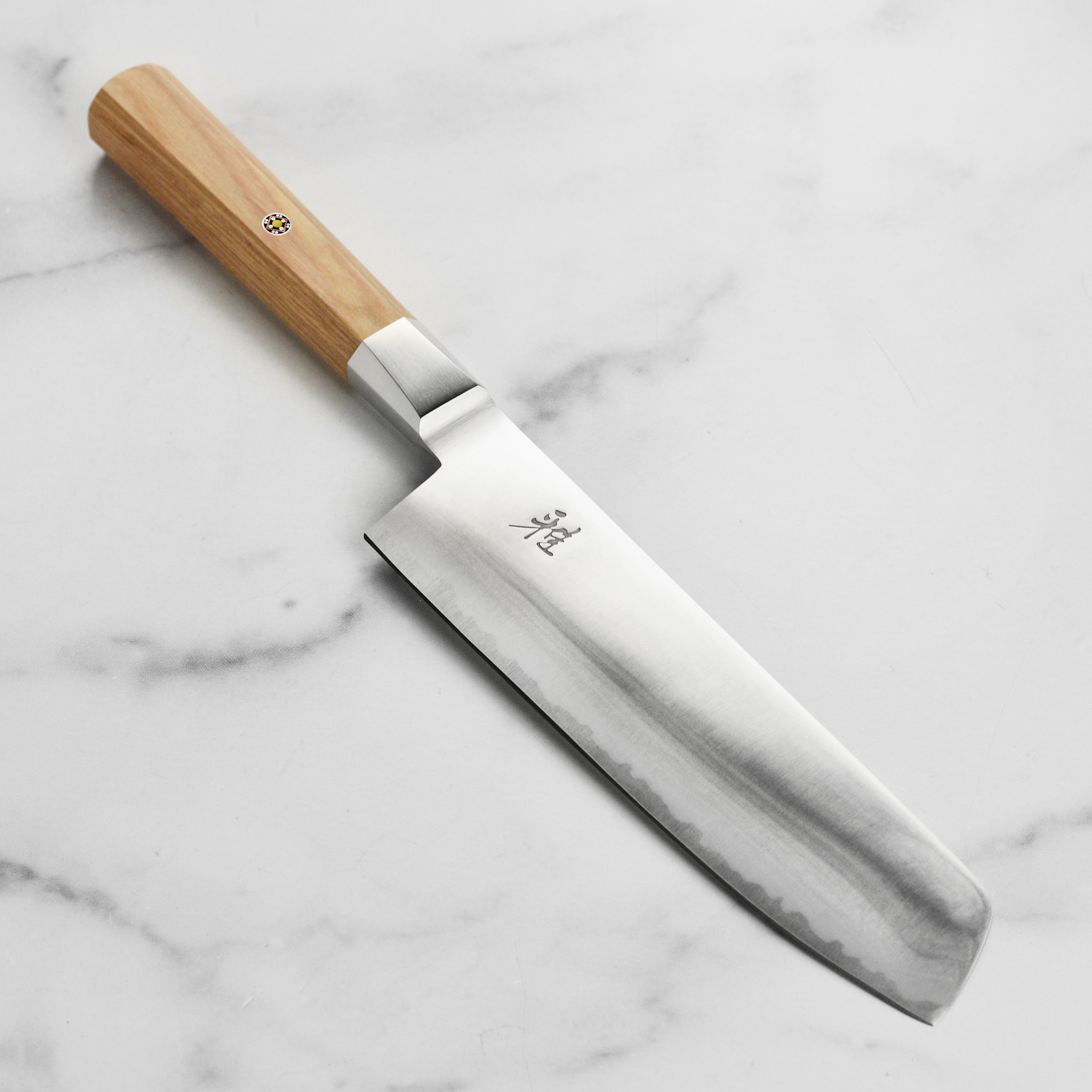 Miyabi Koya Nakiri knife showcasing its sharp Katana edge and elegant design, perfect for vegetable cutting.