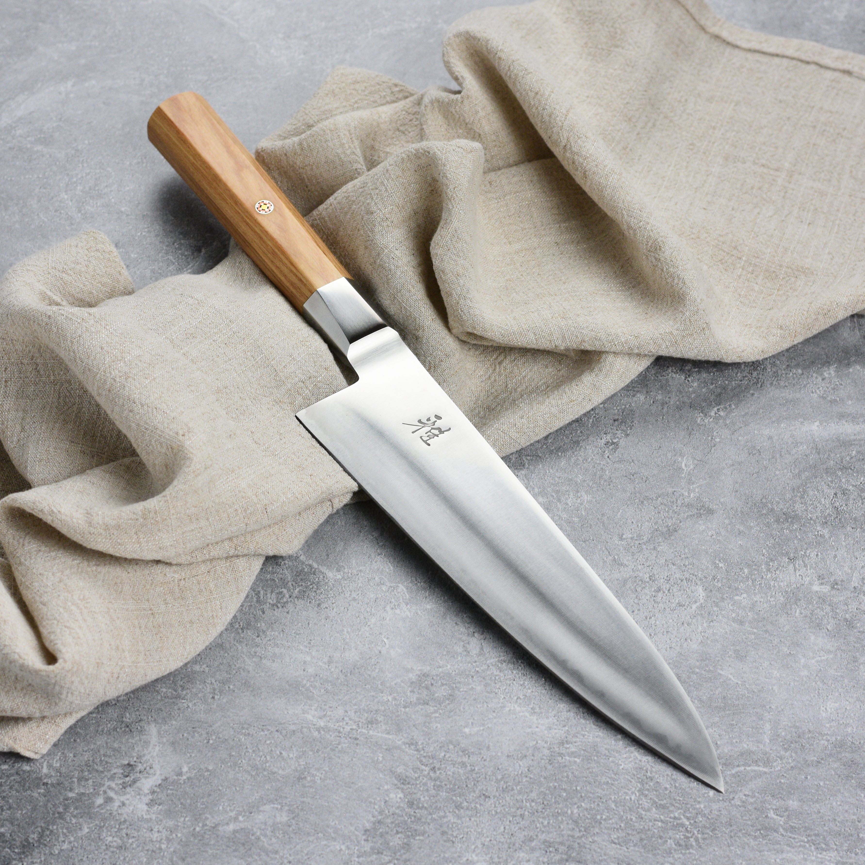 Full view of the Miyabi Koya kitchen knife with birchwood handle for professional chefs