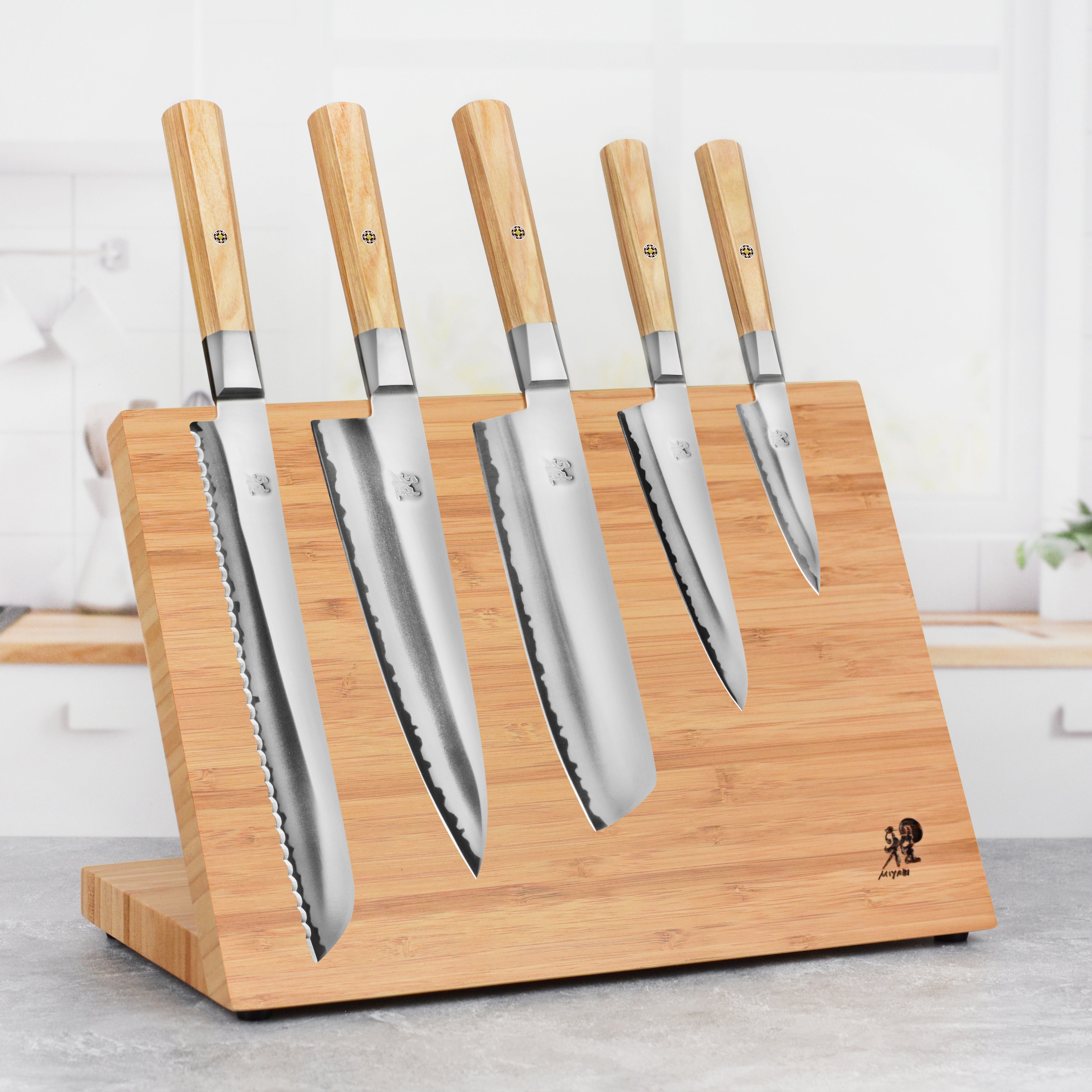 Miyabi Koya 6-piece magnetic knife set arranged on a modern kitchen counter, showcasing Japanese craftsmanship.