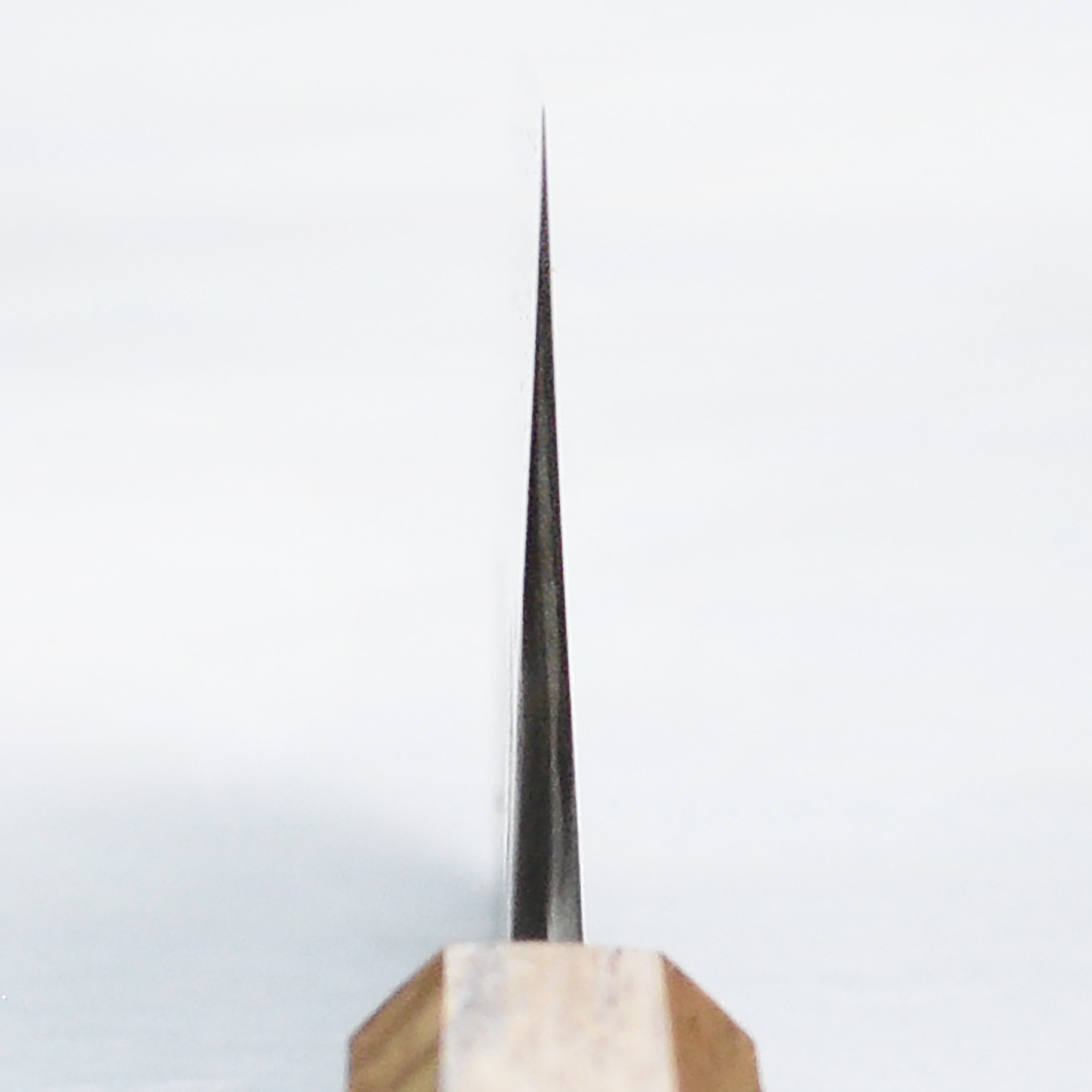 Close-up of the sharp edge of the stainless steel knife showing durability and precision