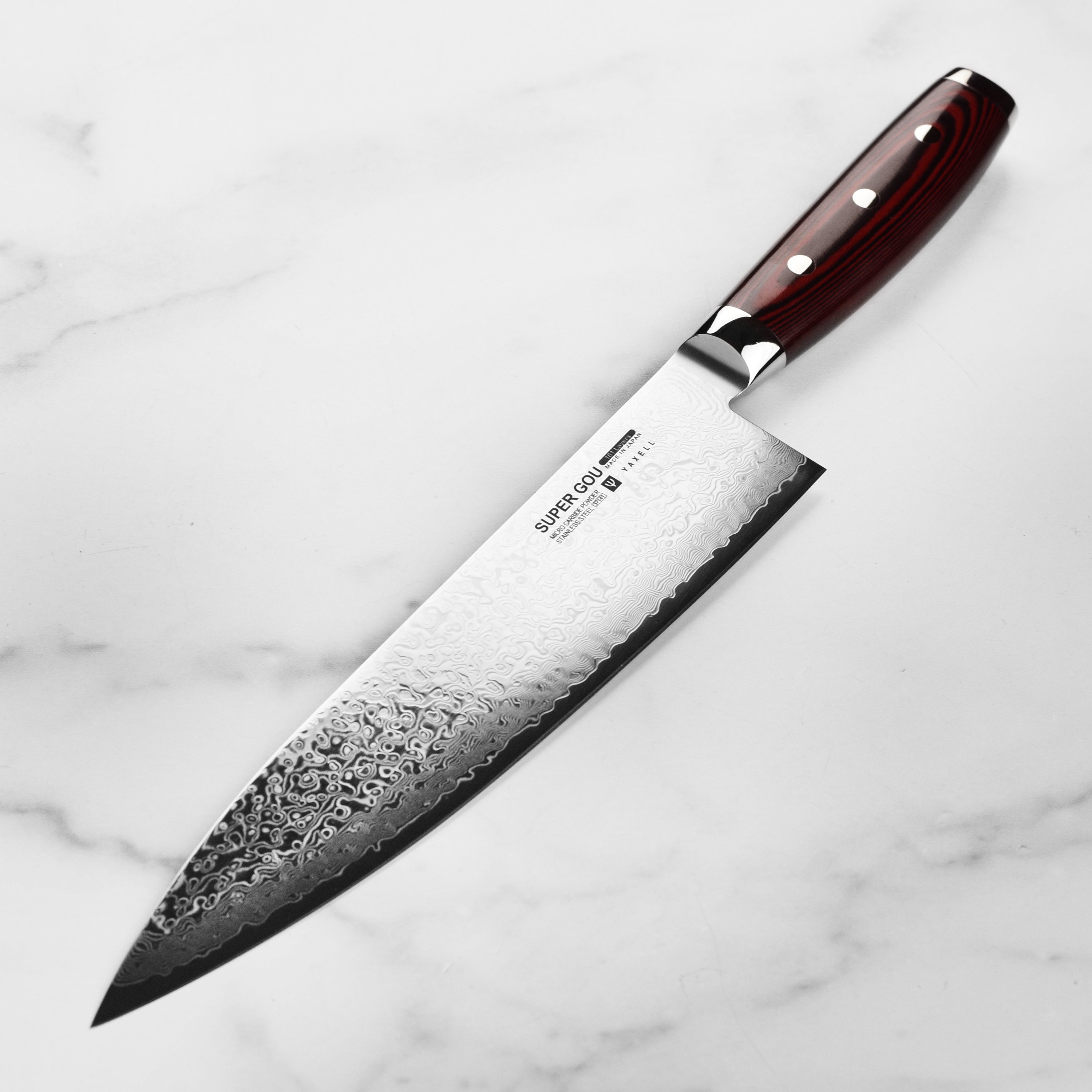 Professional chef using Yaxell SG2 9.5-inch knife for precise slicing