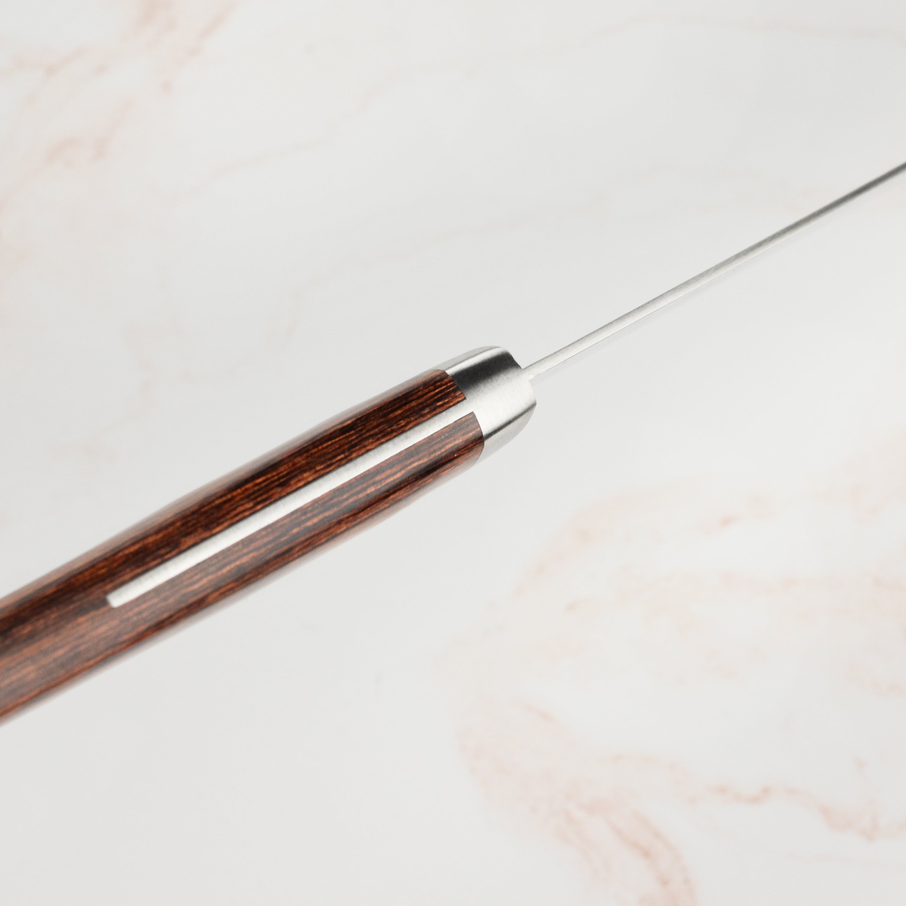 Elegant presentation of the Masutani VG1 Gyuto knife highlighting its craftsmanship and design.