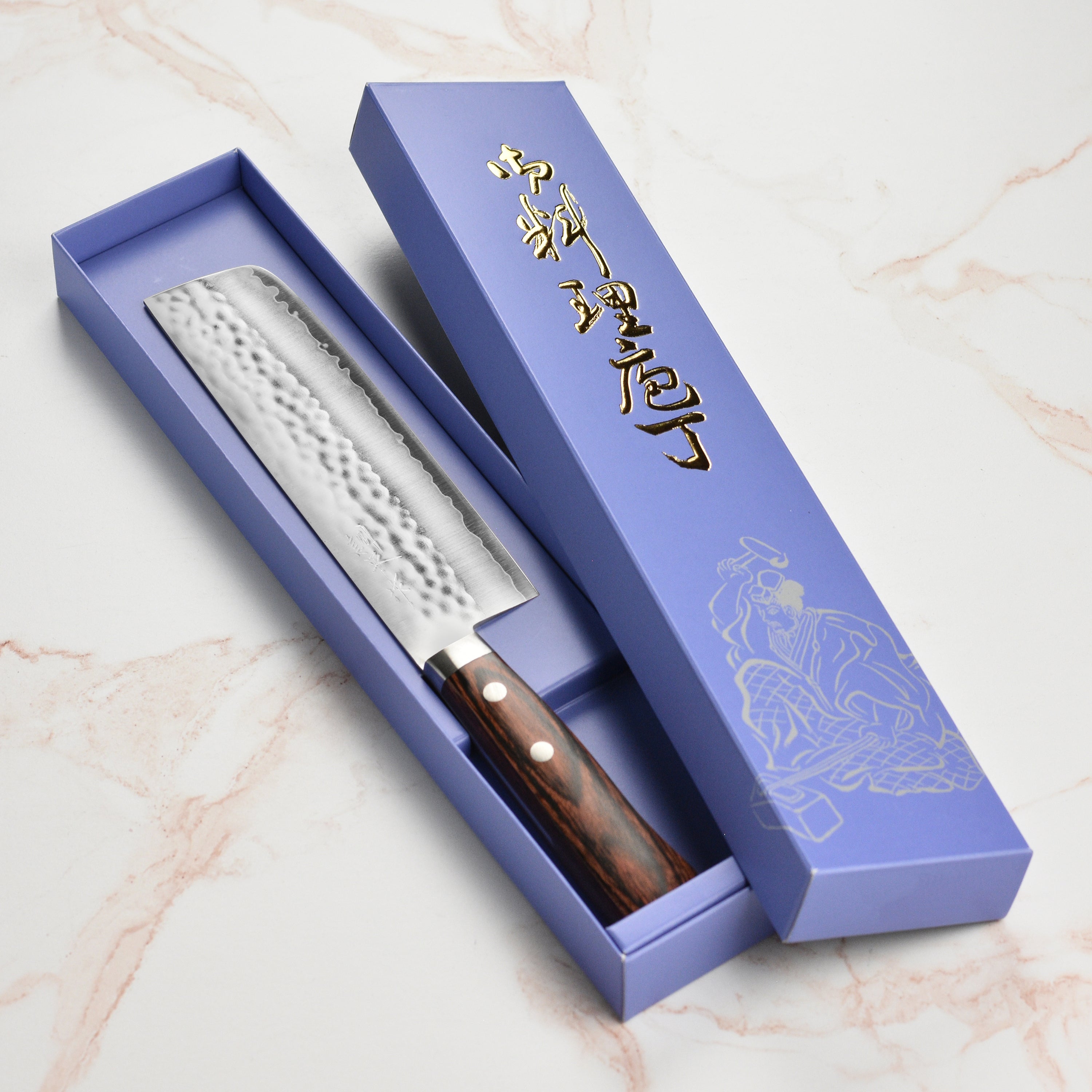 Masutani VG1 hammered Nakiri knife with Pakkawood handle on a cutting board