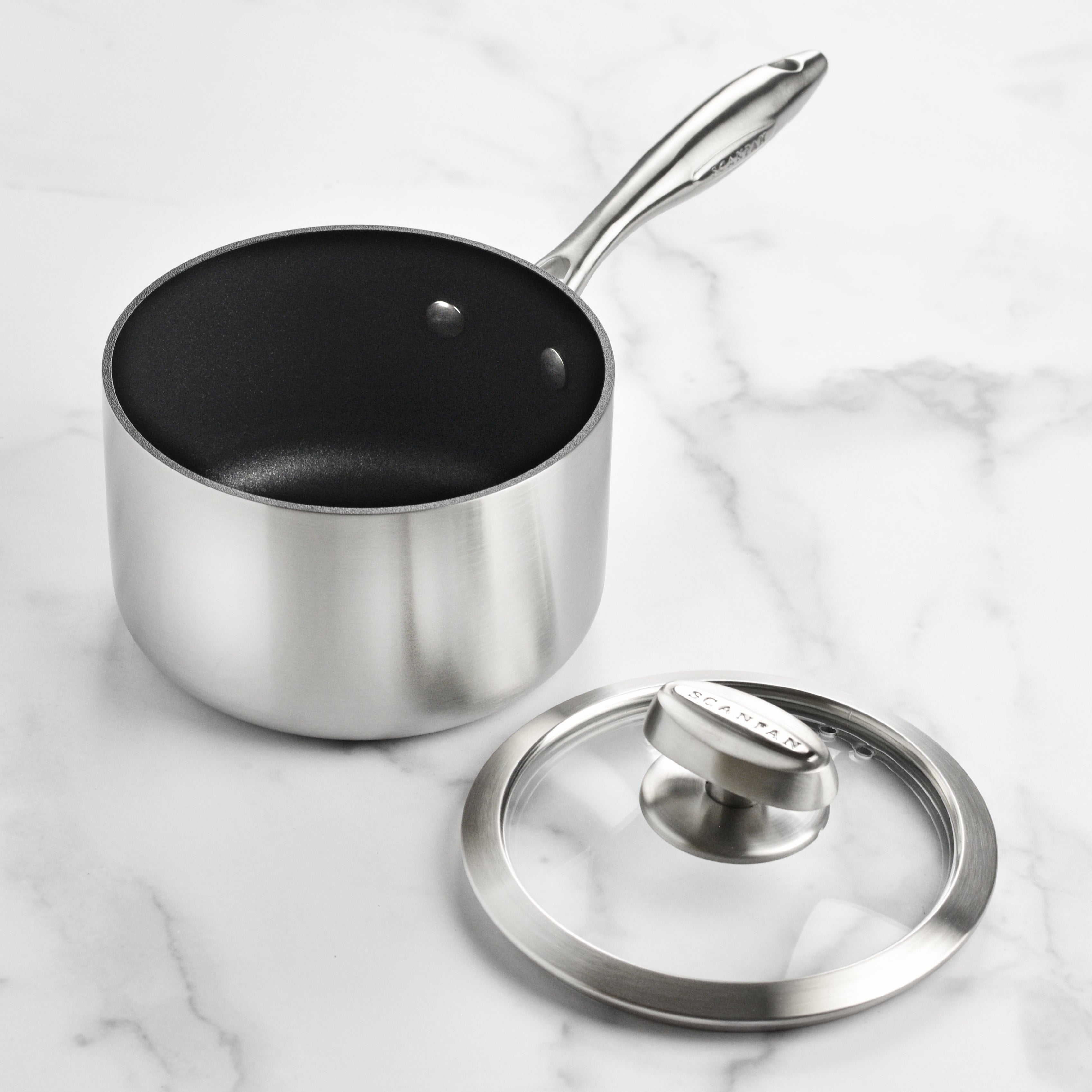 View of the Scanpan CX+ 2-quart durable nonstick saucepan with glass lid, highlighting its elegant design and sturdy construction.