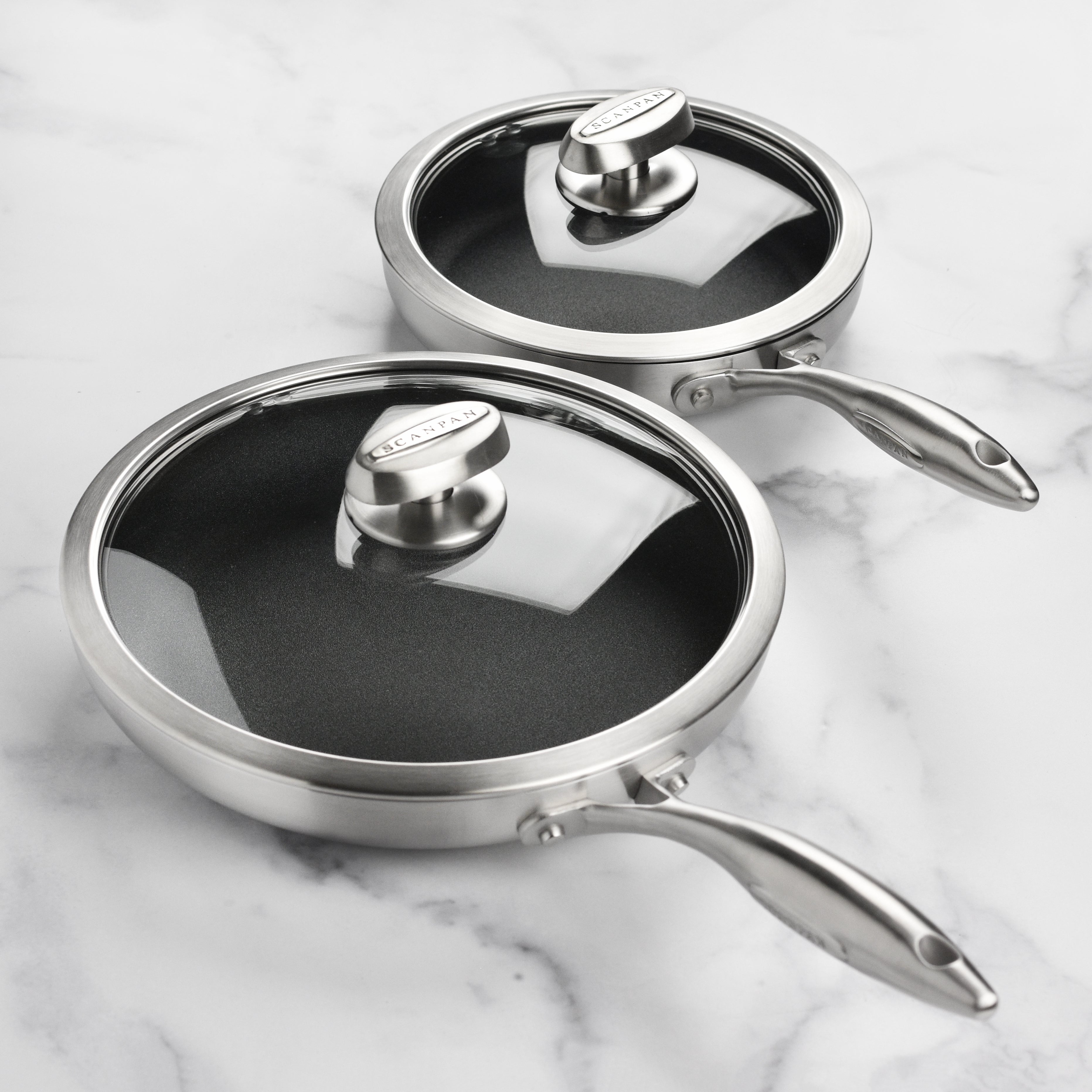The stainless steel nonstick fry pan set in use, demonstrating even cooking on an induction stovetop.