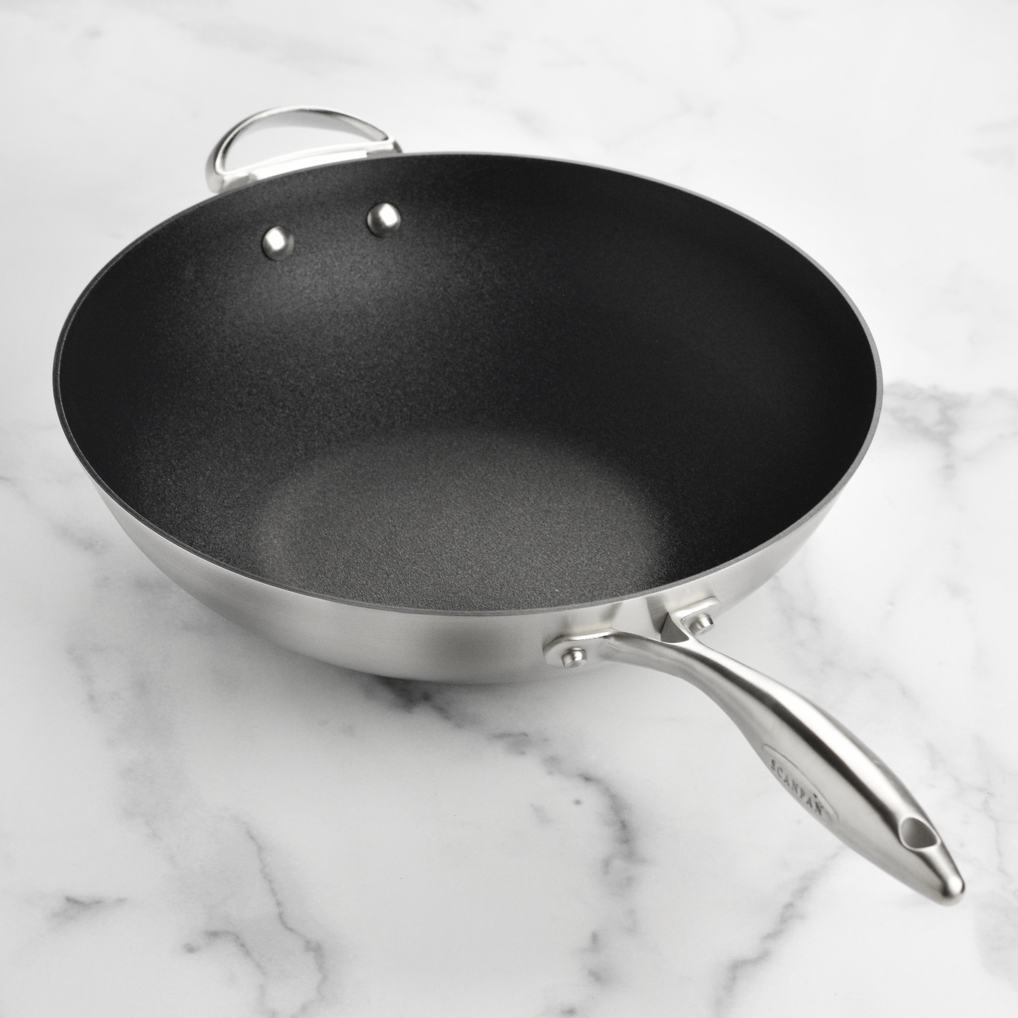 Side view of the Castpan CX+ wok, highlighting the stainless steel handles.