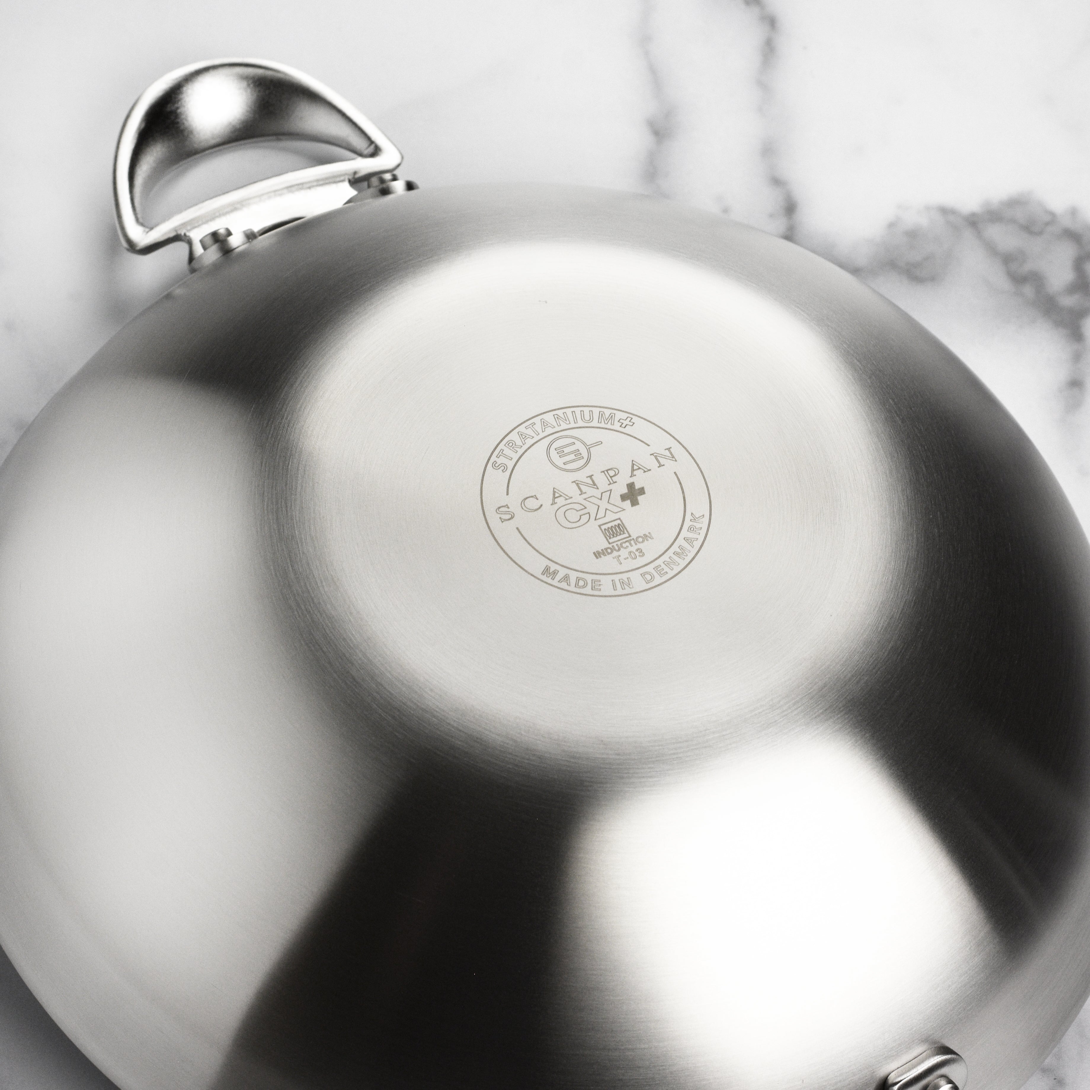 Castpan CX+ wok from a top angle, showcasing its durable nonstick surface.
