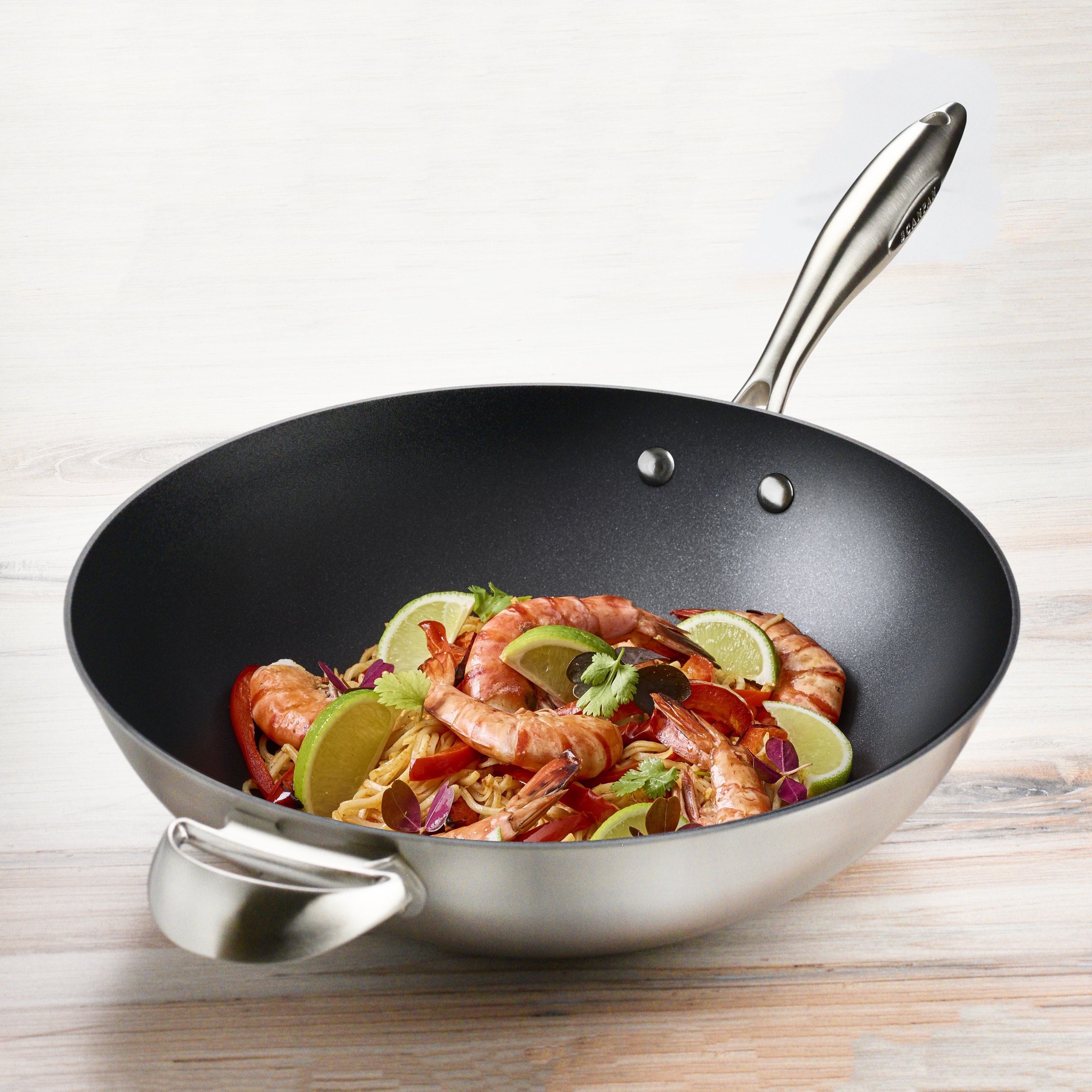 Side view of the Castpan CX+ wok, highlighting the stainless steel handles.
