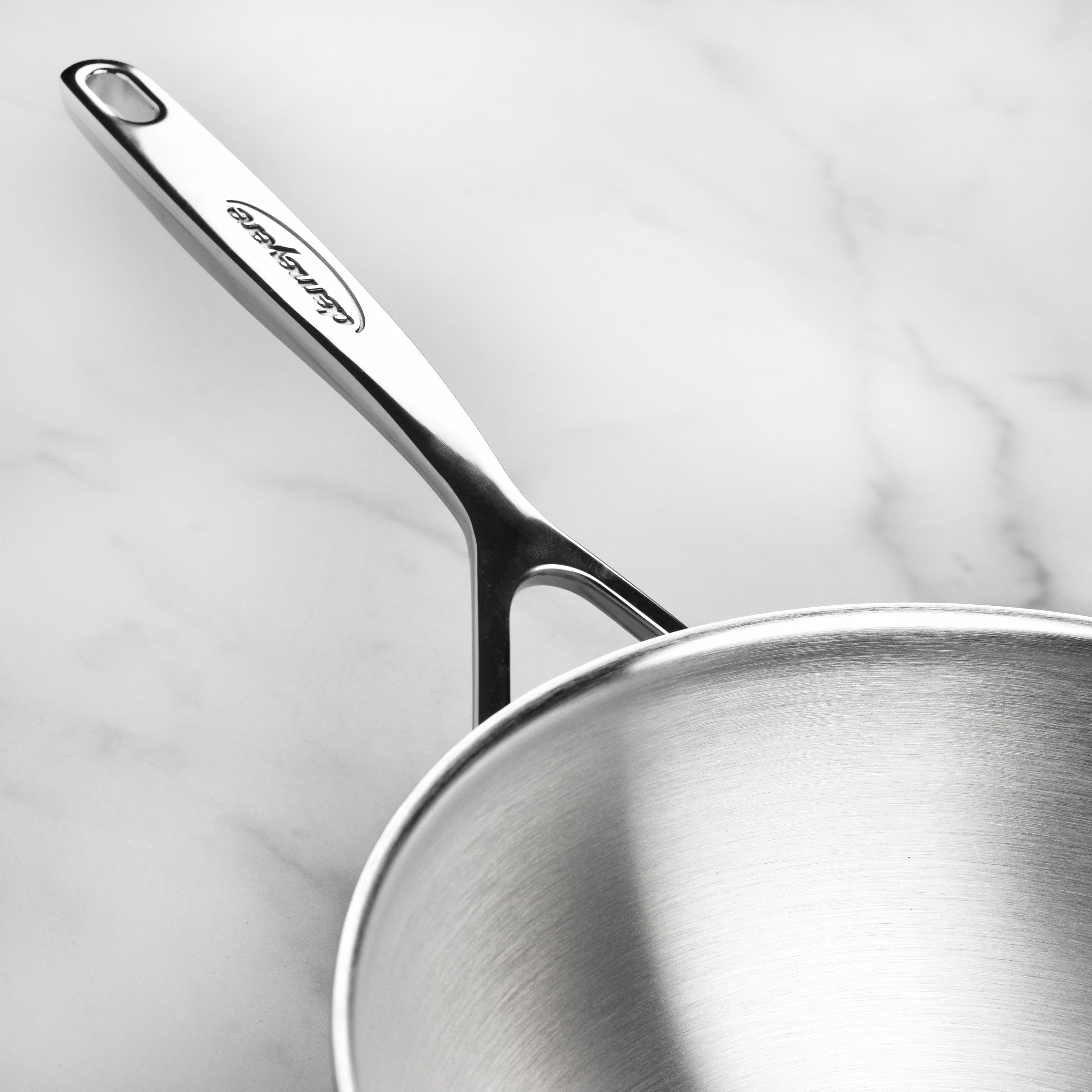 Wok handle detail highlighting stay-cool welded design