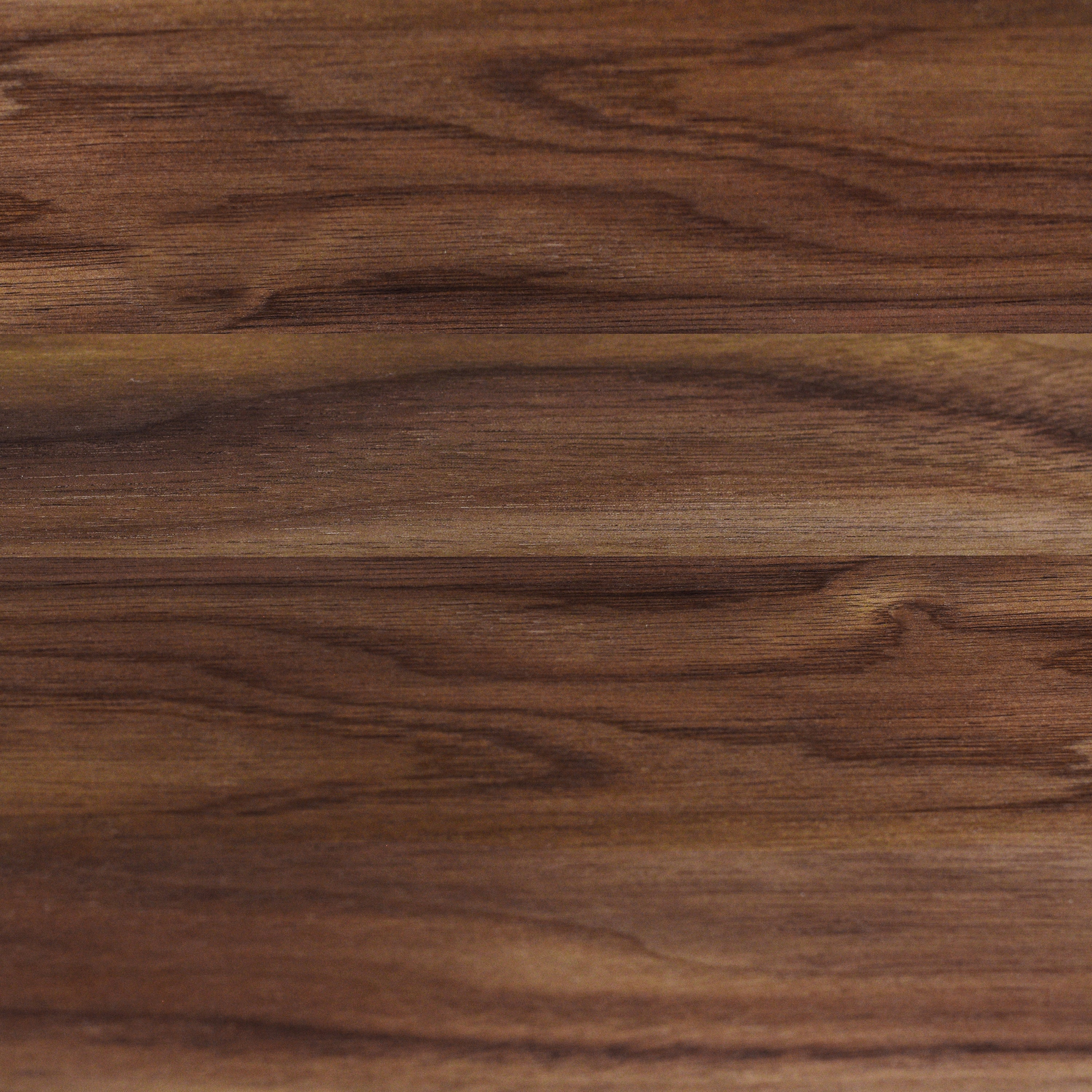 Chef using the walnut cutting board for food preparation in a modern kitchen.