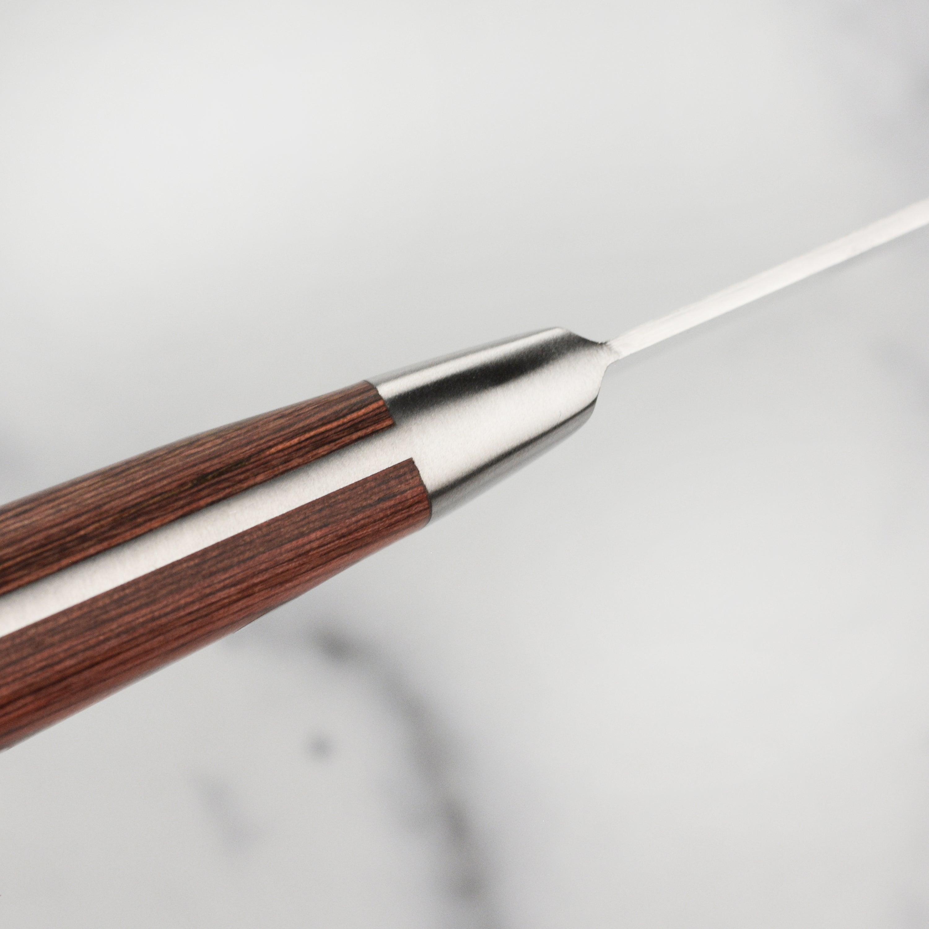 All six knives from the BBQ knife set arranged neatly, emphasizing their elegant design and functional handles.