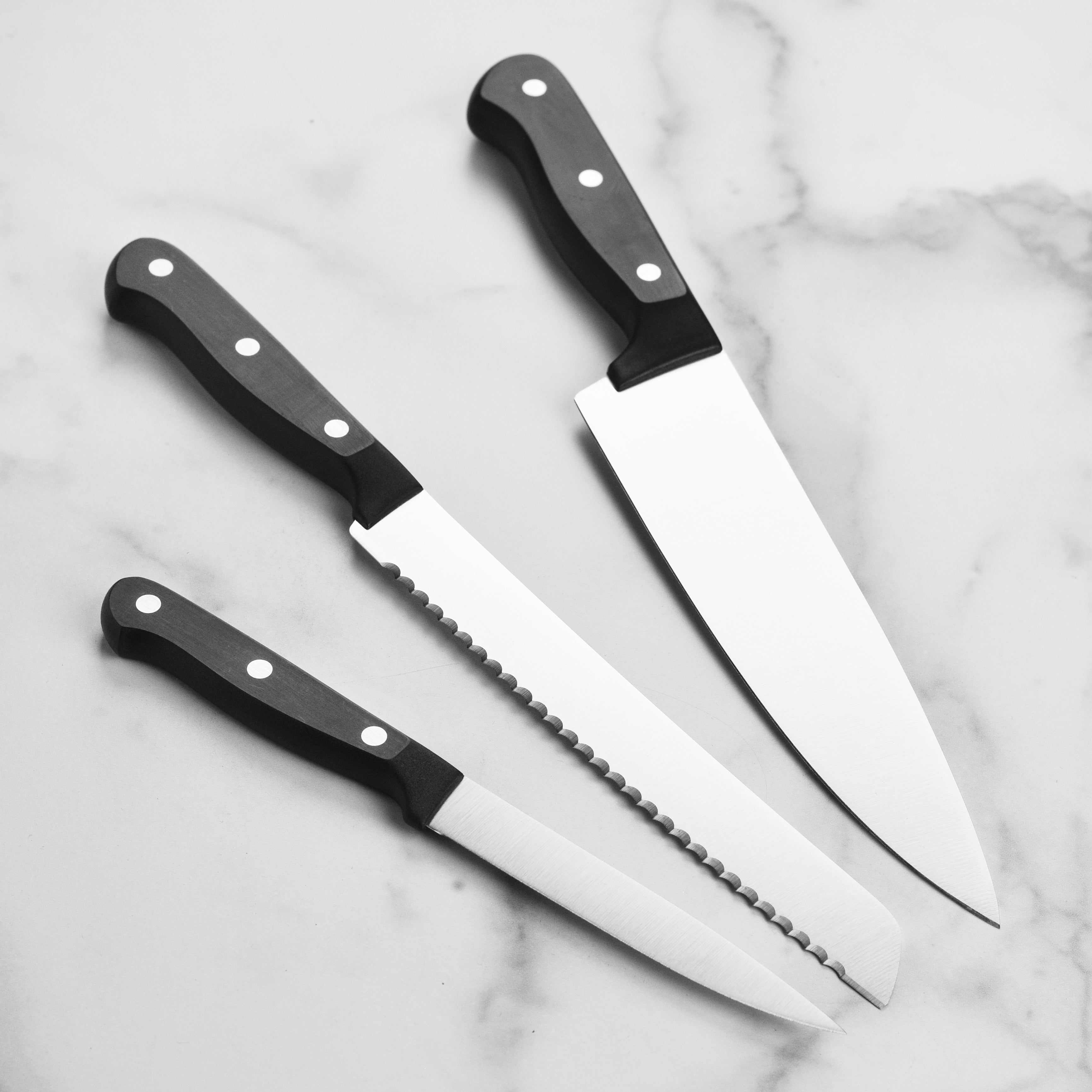 Close-up view of the Wusthof chef knife in action, slicing fresh vegetables with precision.