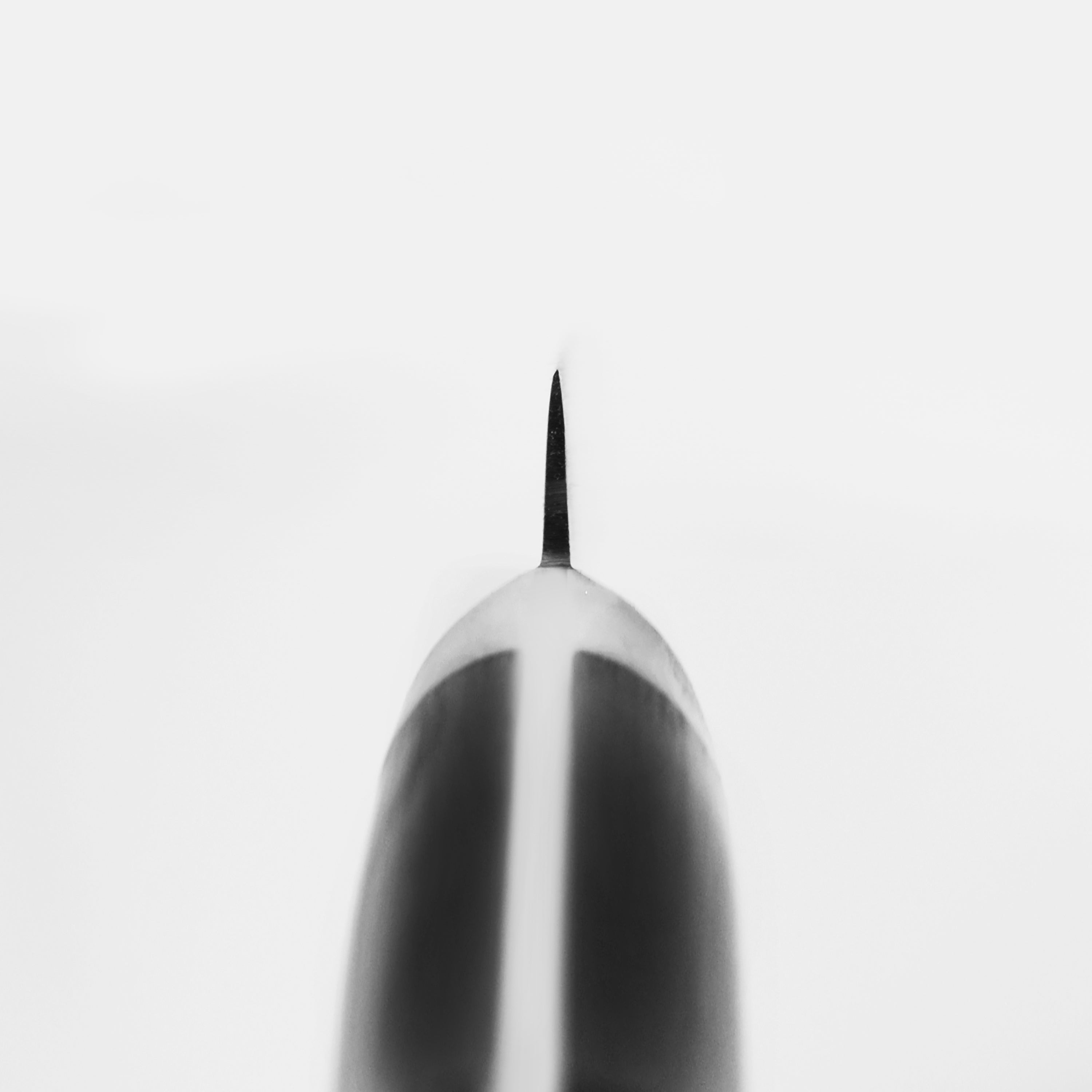 Misono Swedish carbon steel petty knife with a full-tang Pakkawood handle, ideal for kitchen use.