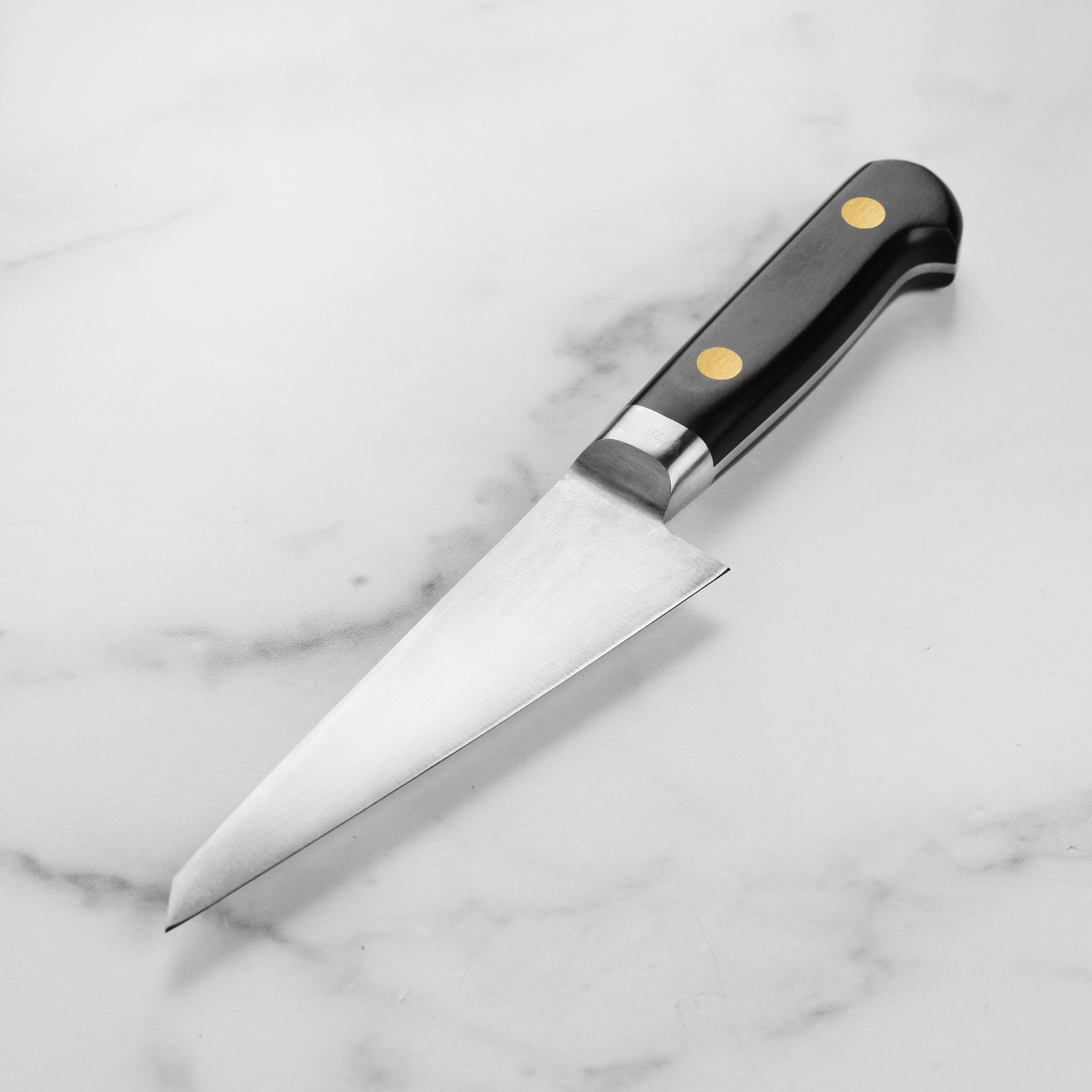 Close-up of the Pakkawood handle of the Misono Honesuki, highlighting its craftsmanship and ergonomic design.