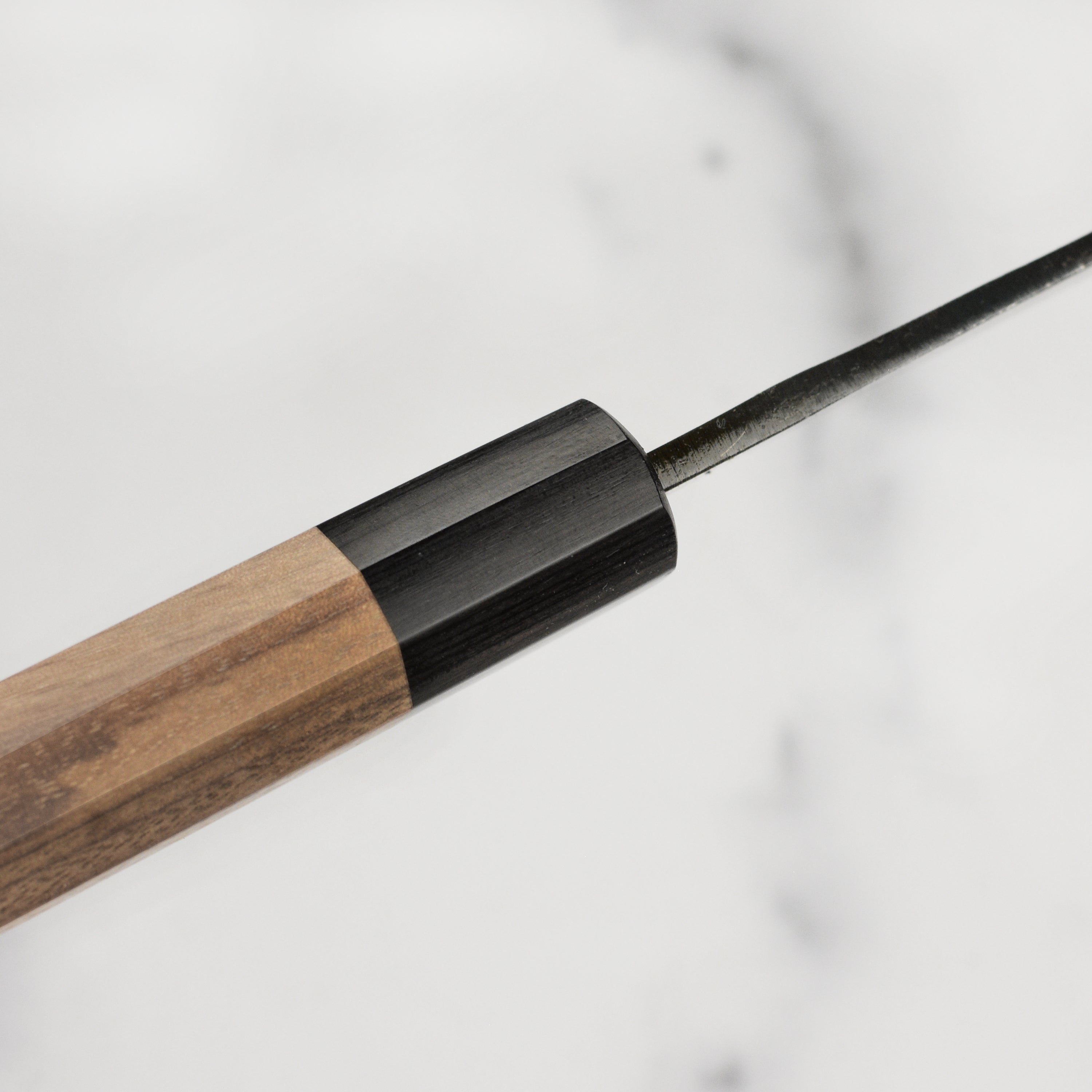 Top view showing the full length and craftsmanship of the cheap Japanese gyuto knife with walnut octagonal handle