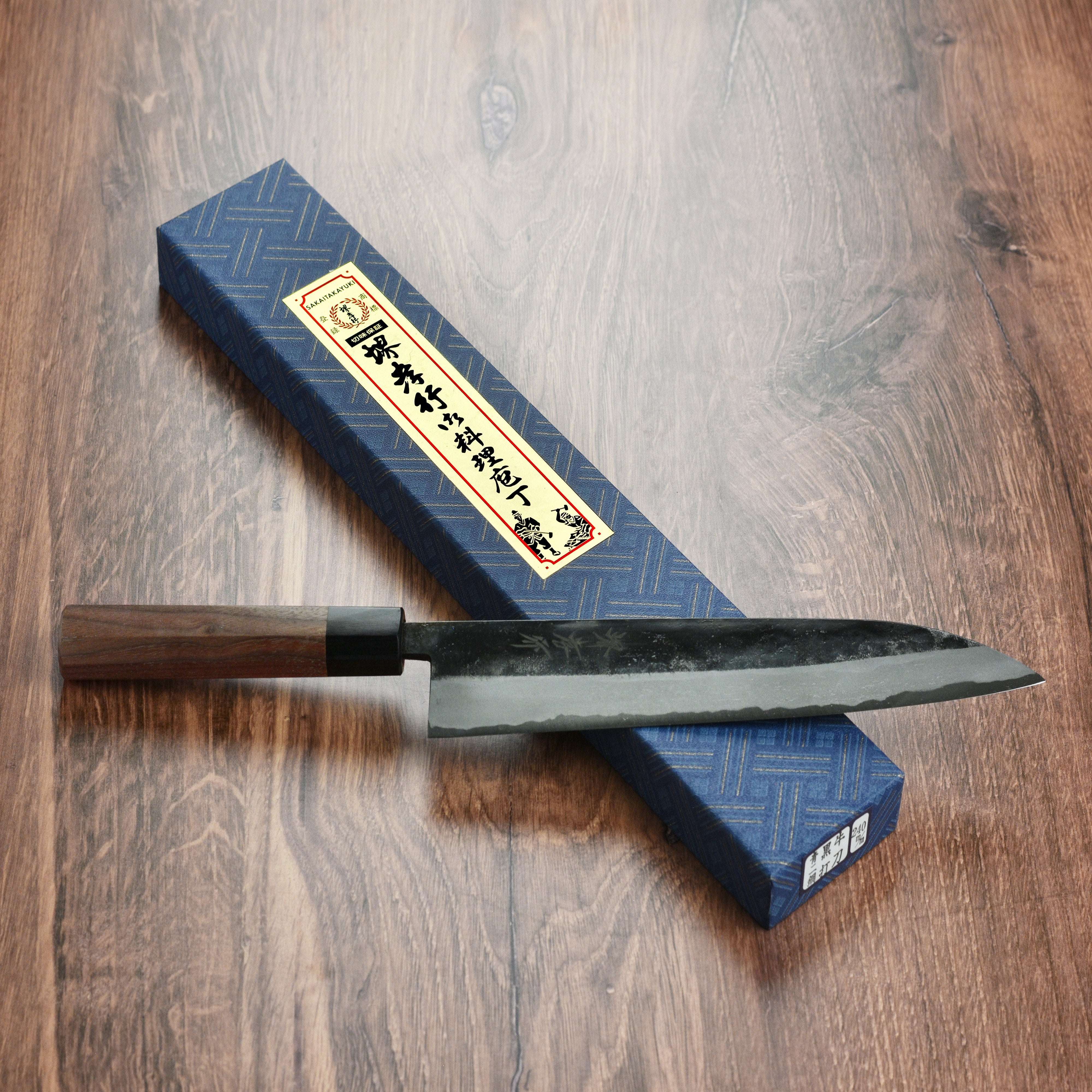 Top view showing the full length and craftsmanship of the cheap Japanese gyuto knife with walnut octagonal handle