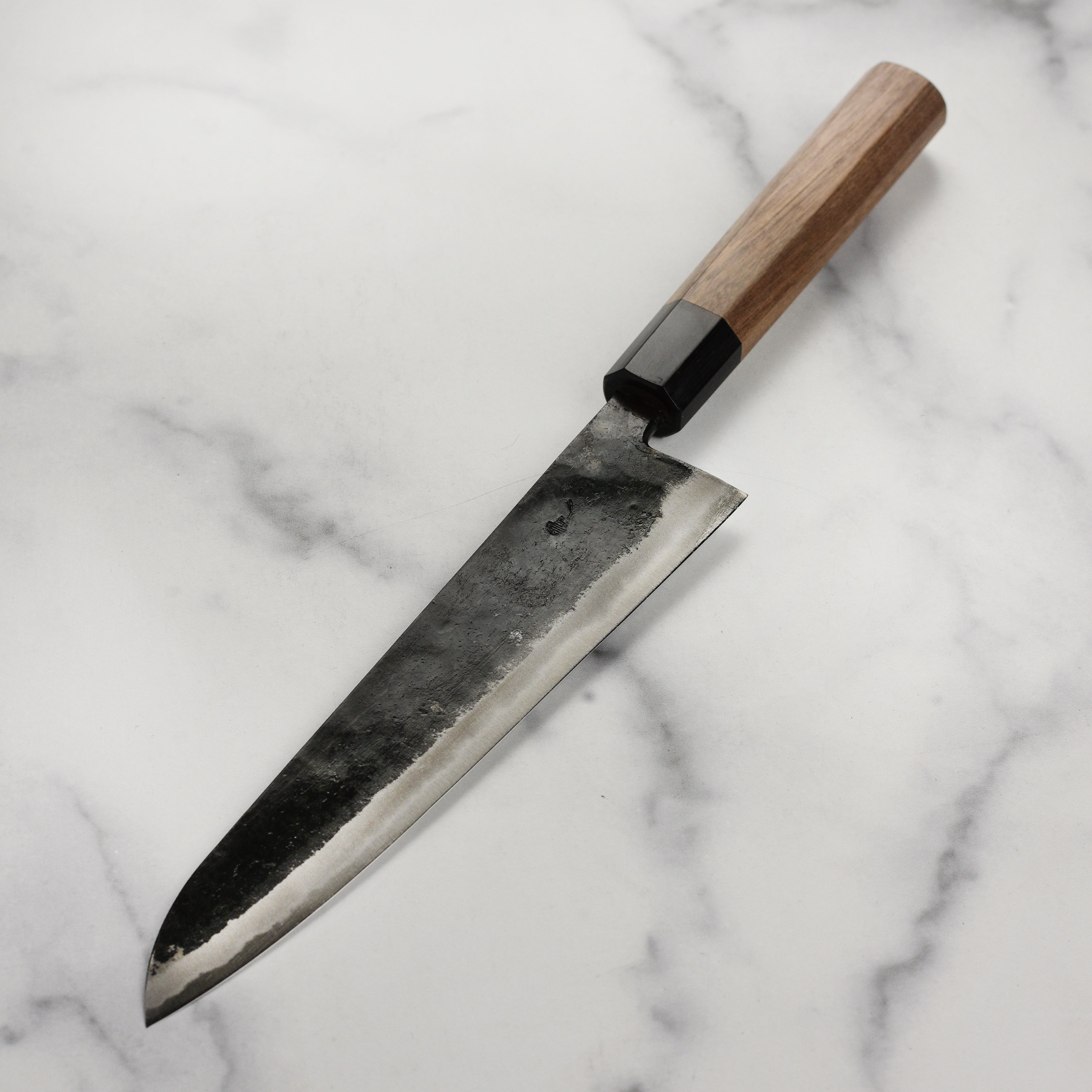 Close-up of the sharp edge of the Takayuki Aogami Gyuto for professional kitchen use