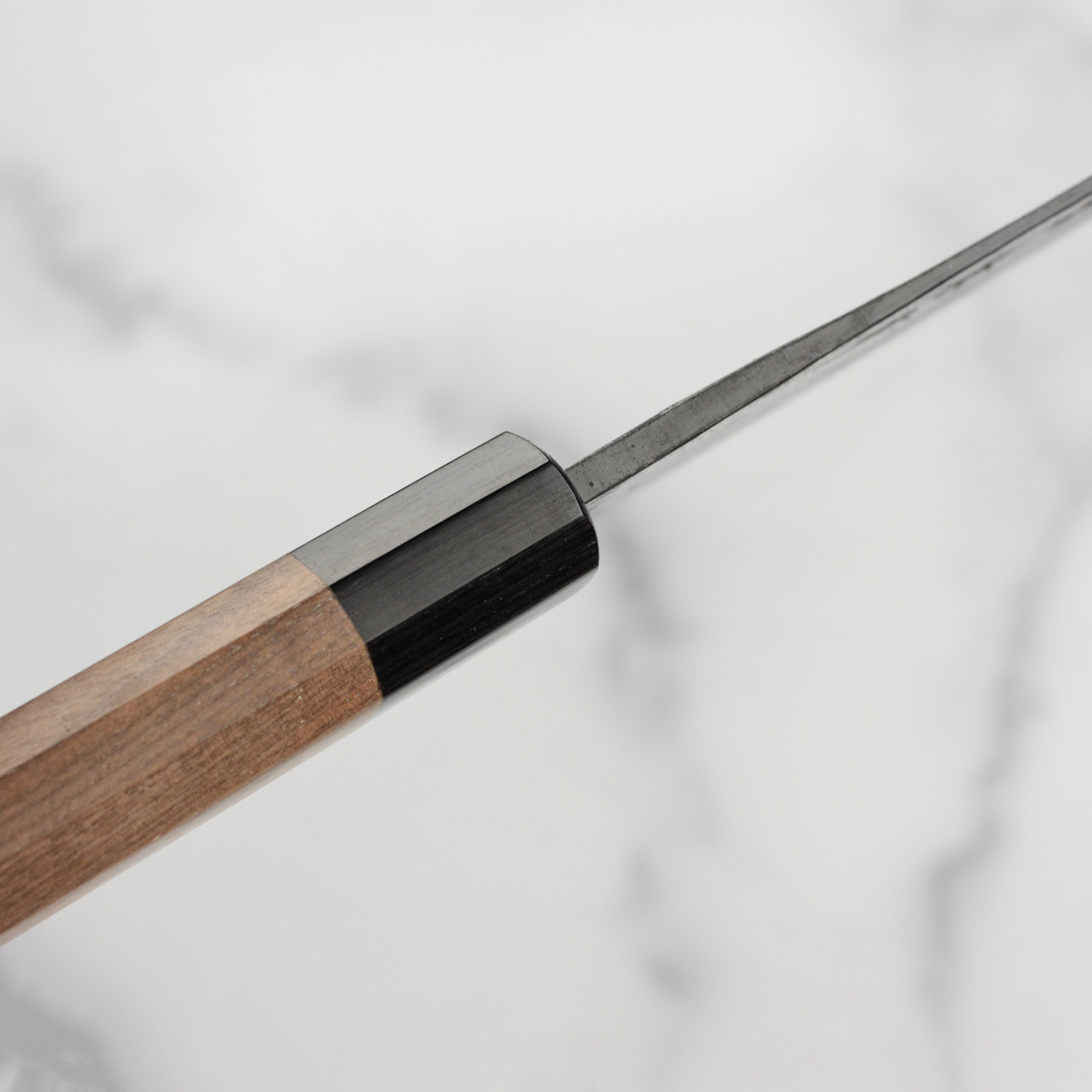 Close-up of the sharp edge of the Takayuki Aogami Gyuto for professional kitchen use