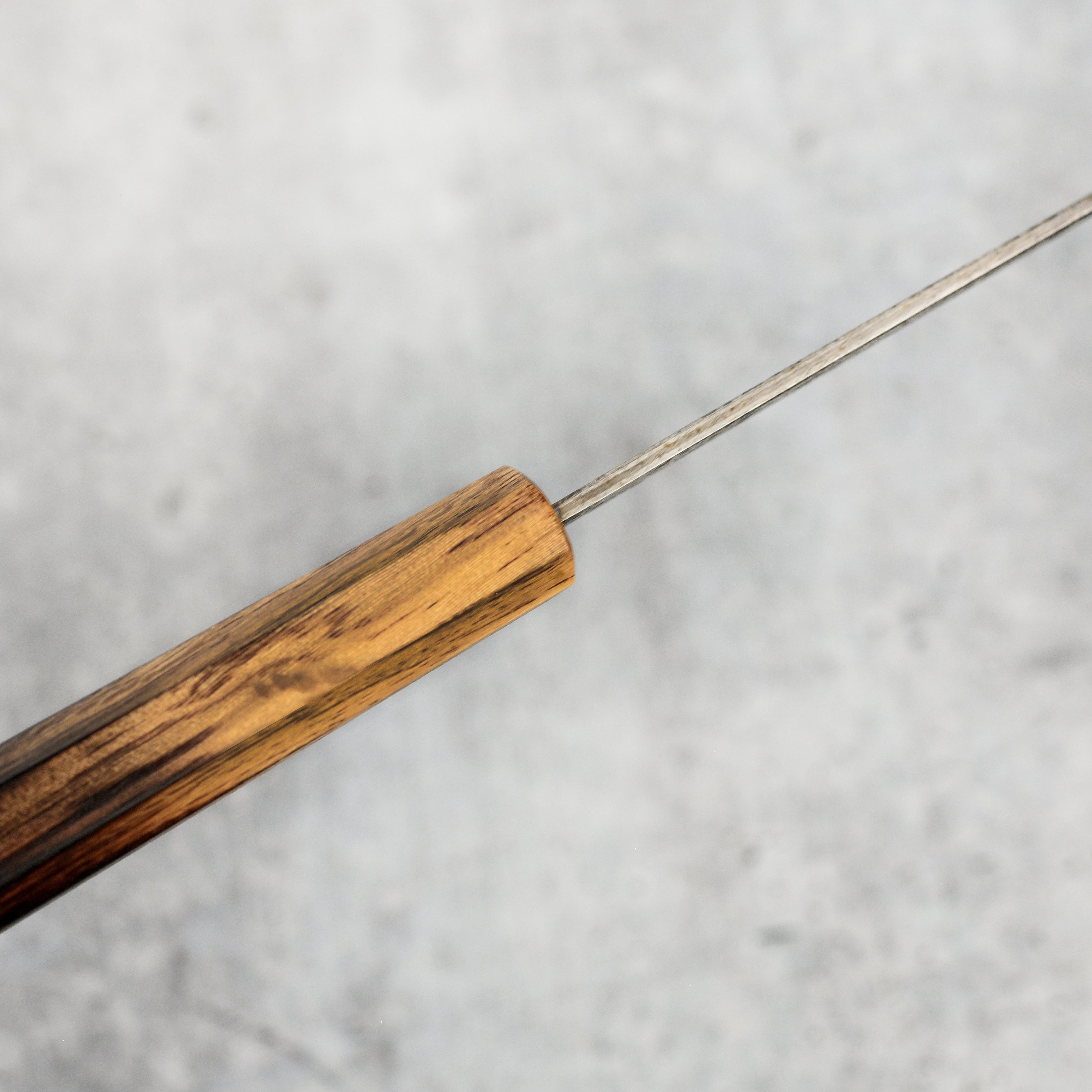 Display of the Aogami #2 carbon steel blade highlighting its sharp edge and craftsmanship.