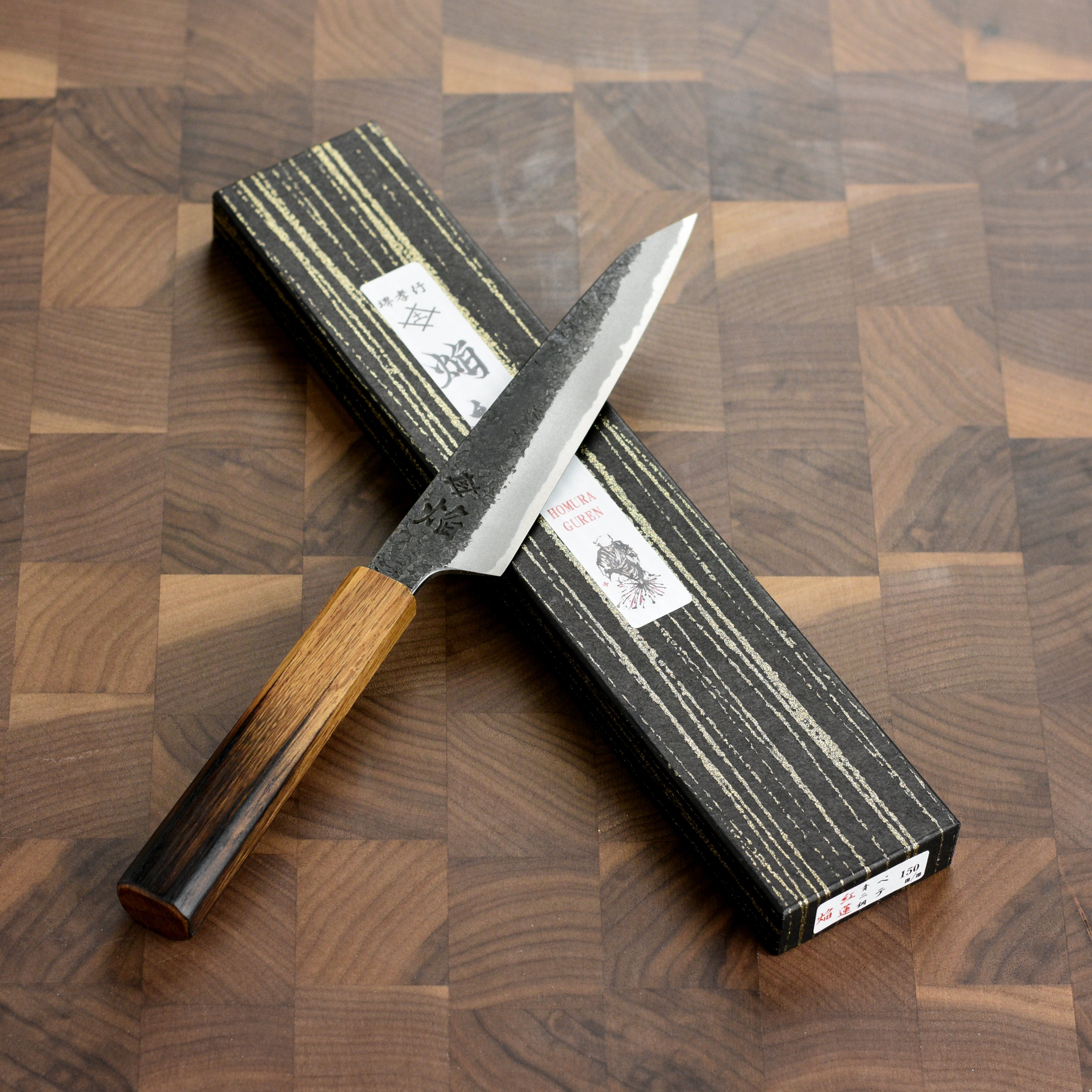 Display of the Aogami #2 carbon steel blade highlighting its sharp edge and craftsmanship.