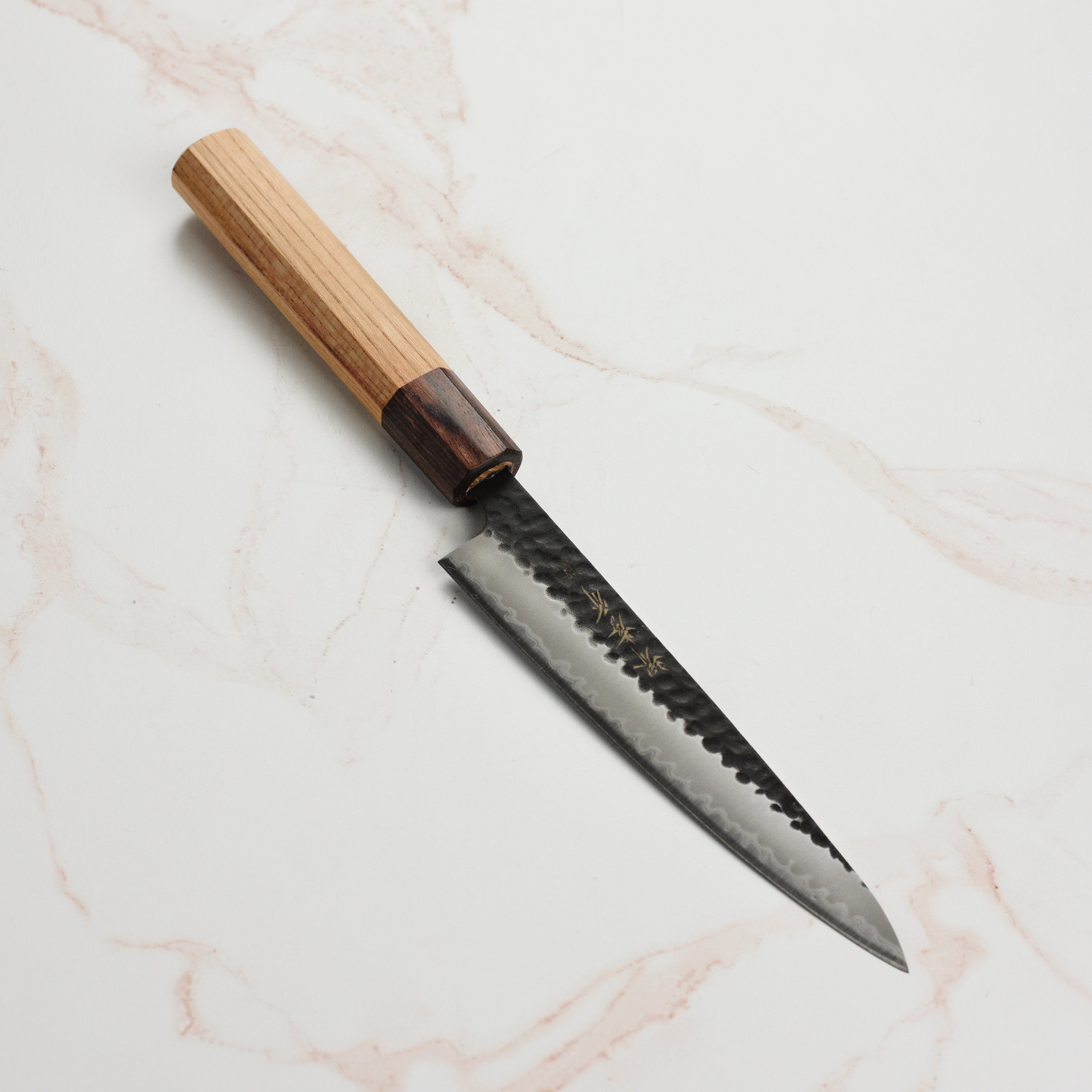 Aogami Super Kurouchi Petty Knife - close-up of the blade and hammered finish