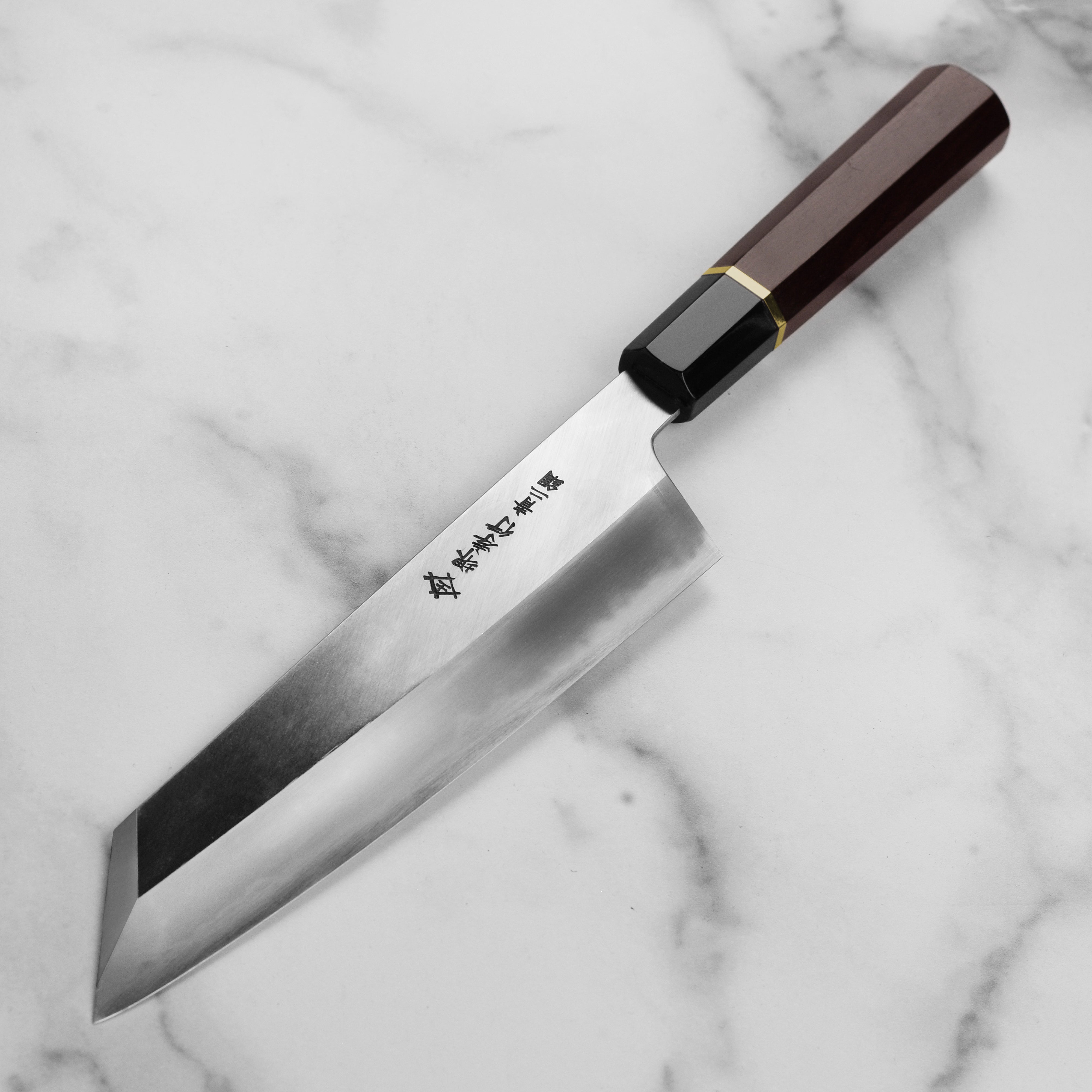 Close-up of the Aogami #2 Gyuto Chef Knifes Kengata tip and matte finish highlighting craftsmanship.