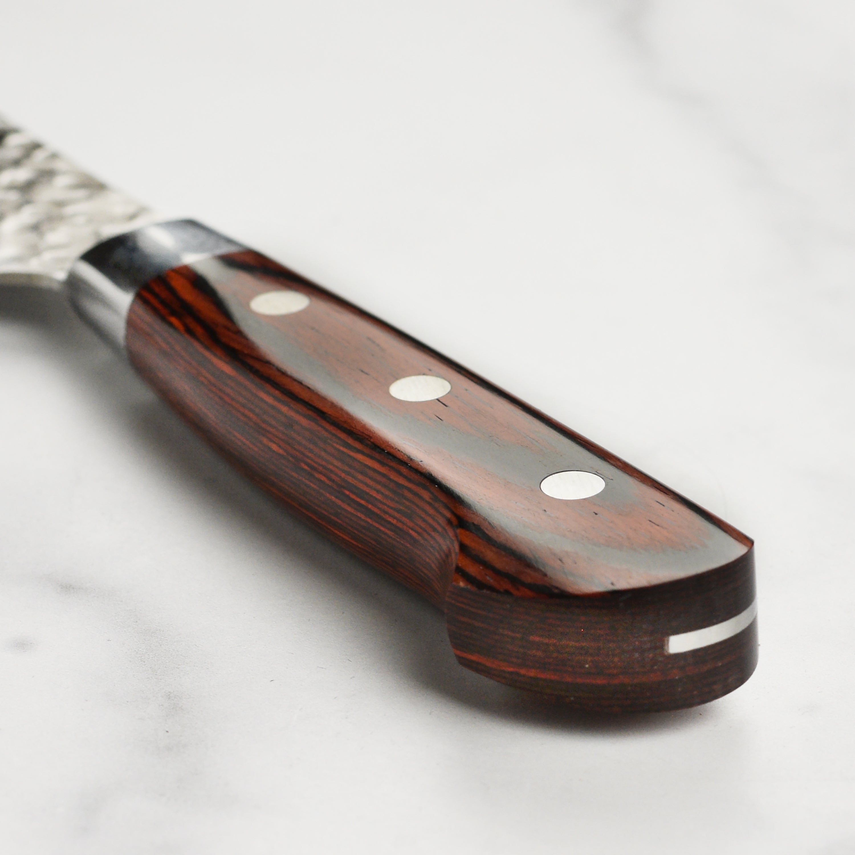 Japanese handmade Damascus knife with full-tang construction and stainless steel rivets