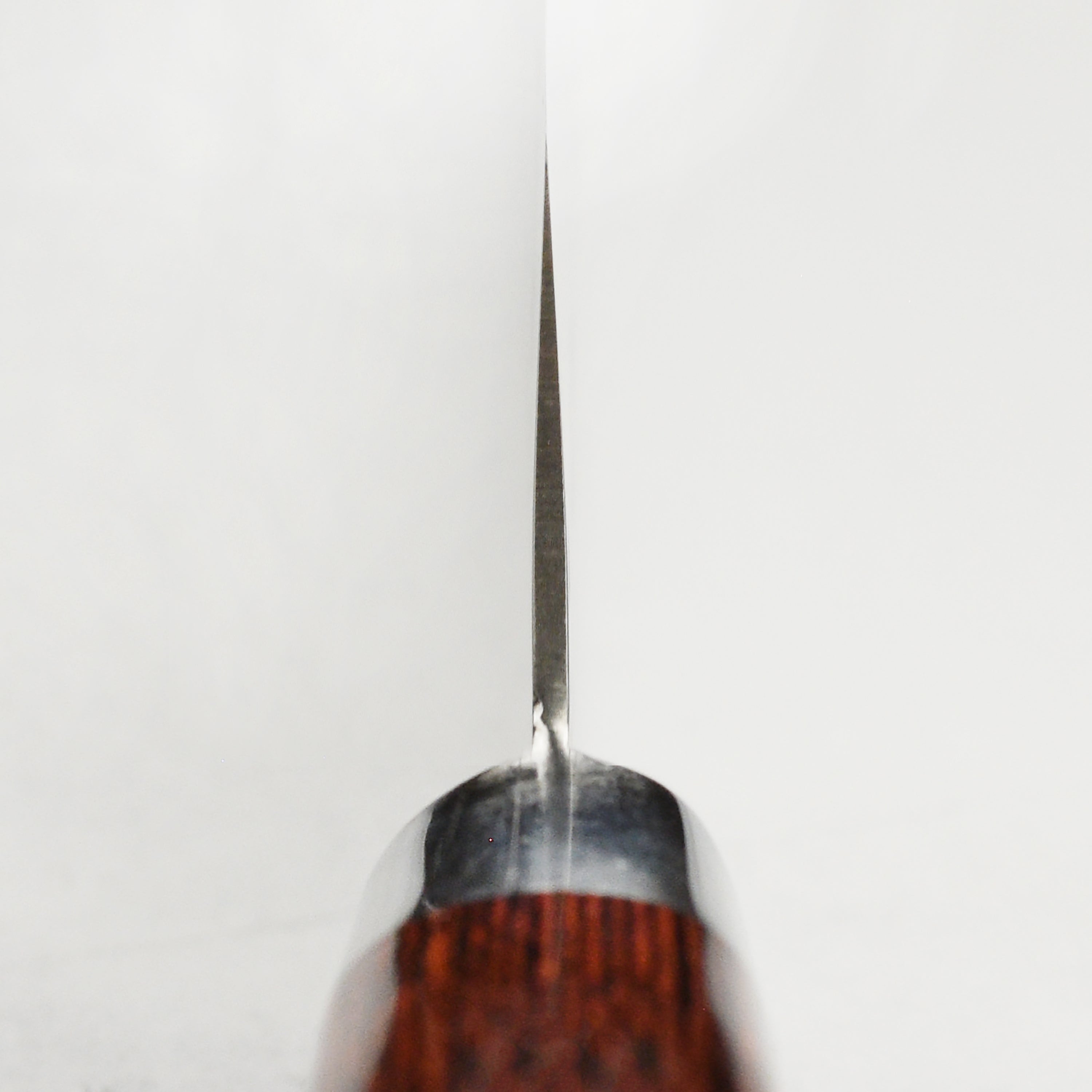 Professional santoku knife in action, slicing vegetables with precision